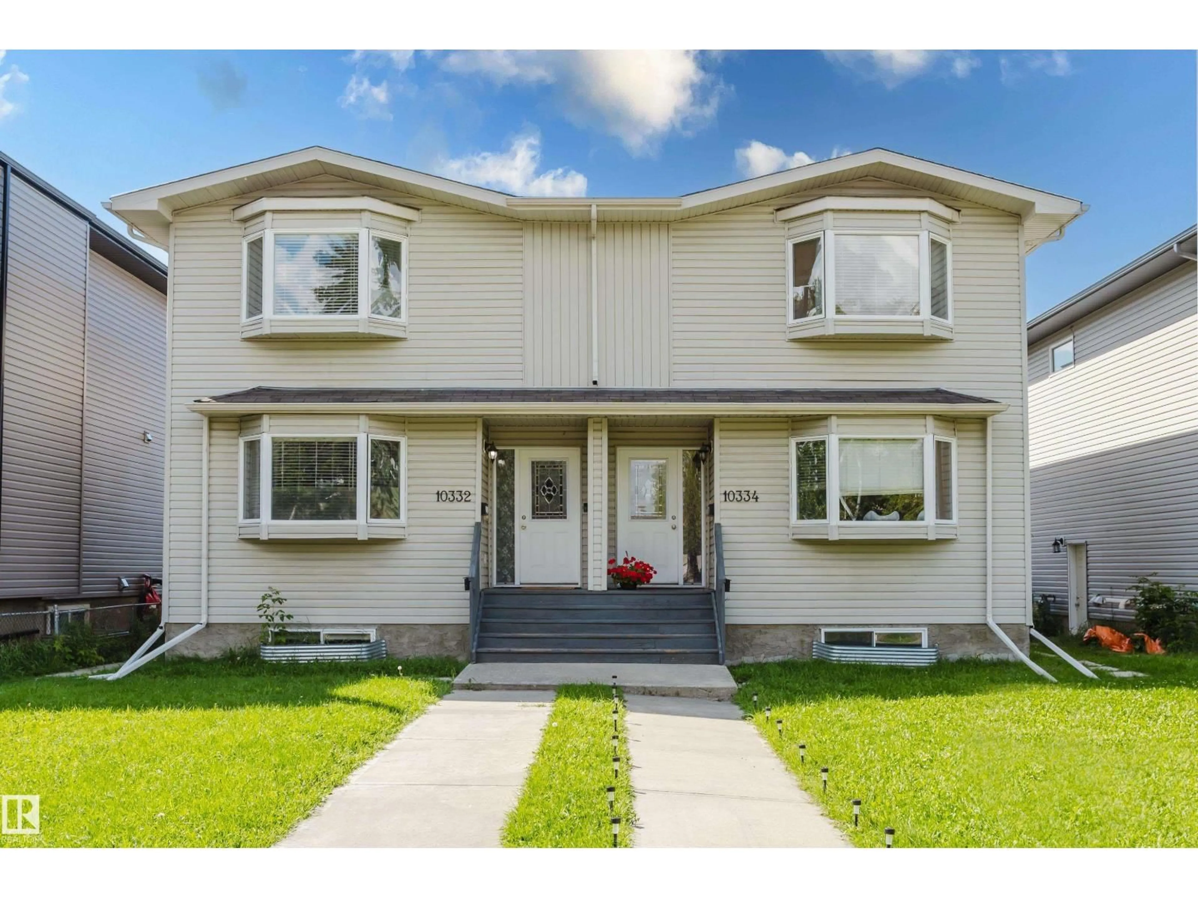 Home with vinyl exterior material, street for NW - 10334 161 ST, Edmonton Alberta T5P3J3