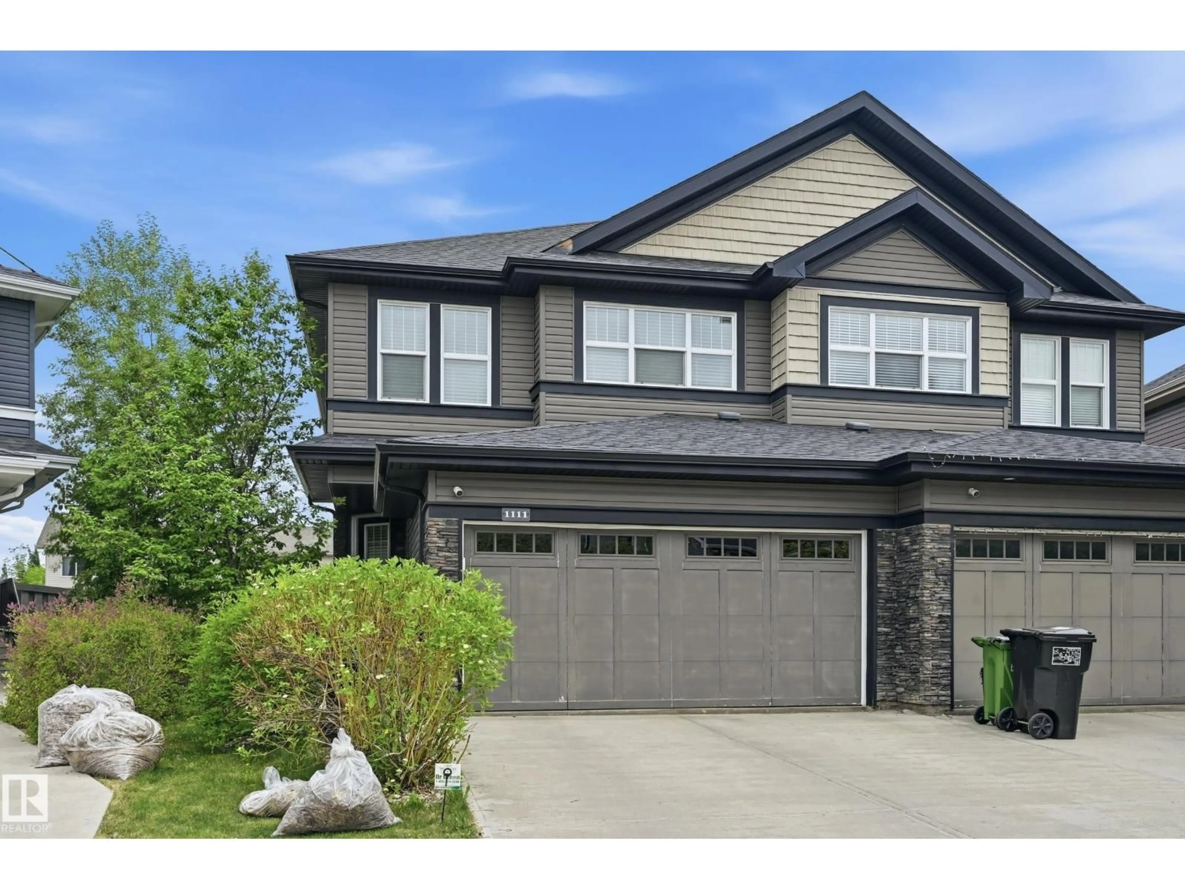Home with vinyl exterior material, street for SW - 1111 176 ST, Edmonton Alberta T6W2B7