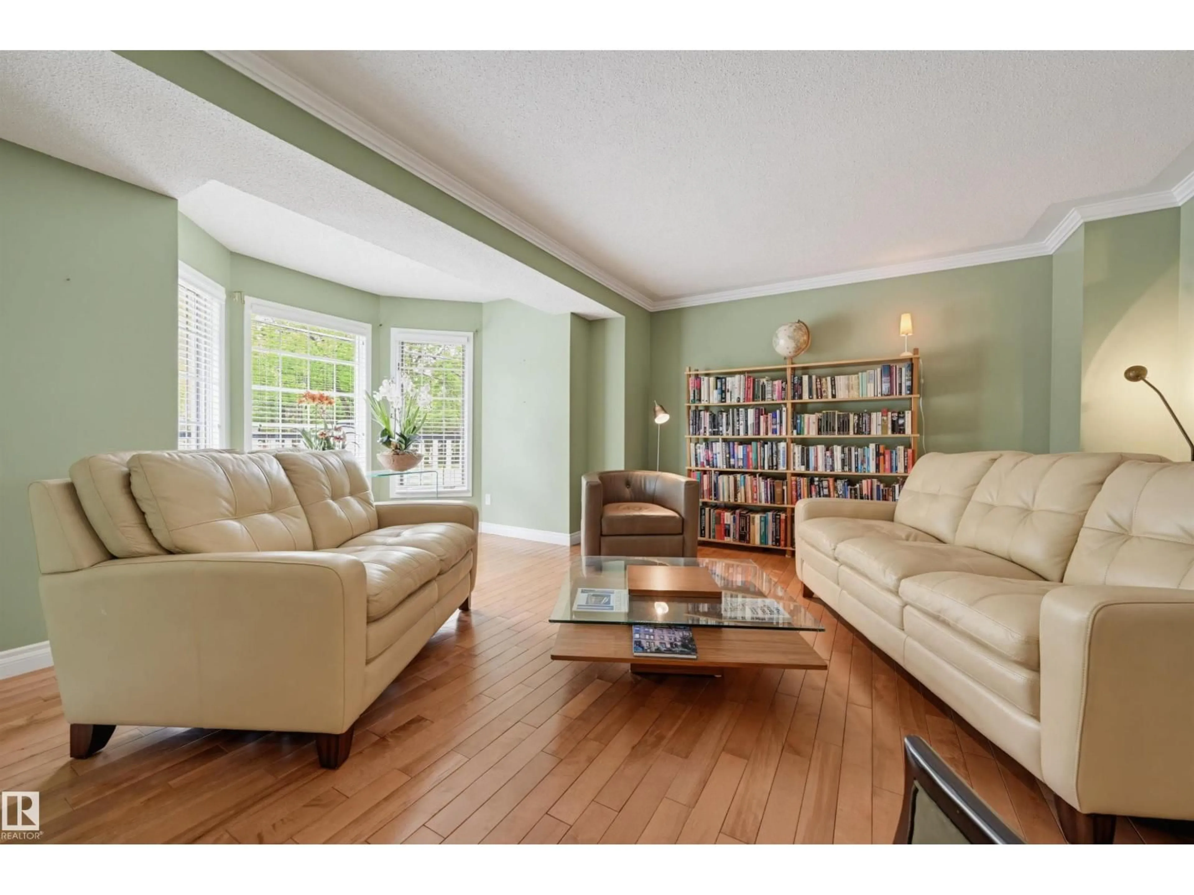 Living room with furniture, wood/laminate floor for NW - 11107 98 AV, Edmonton Alberta T5K0E1