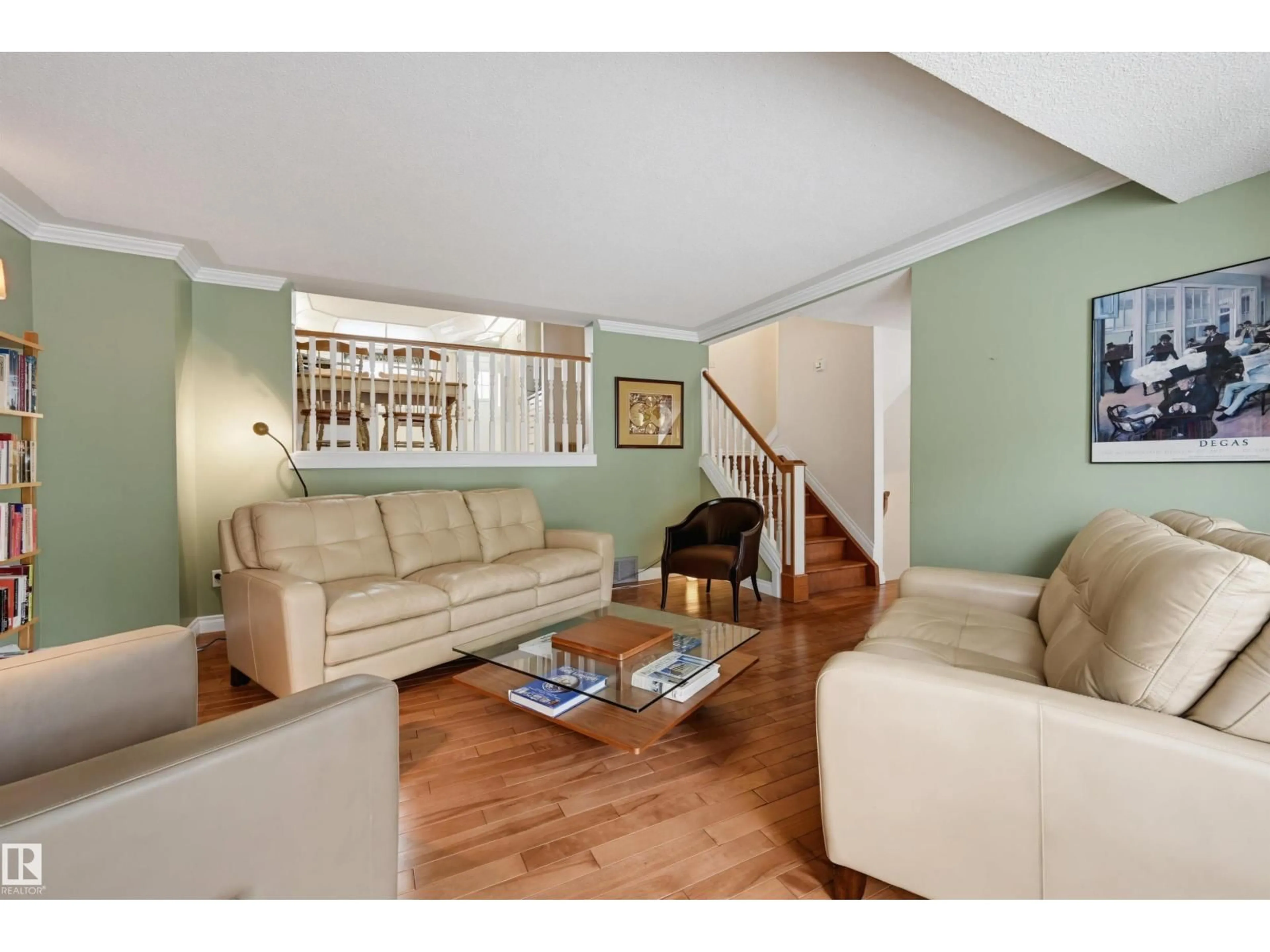 Living room with furniture, wood/laminate floor for NW - 11107 98 AV, Edmonton Alberta T5K0E1