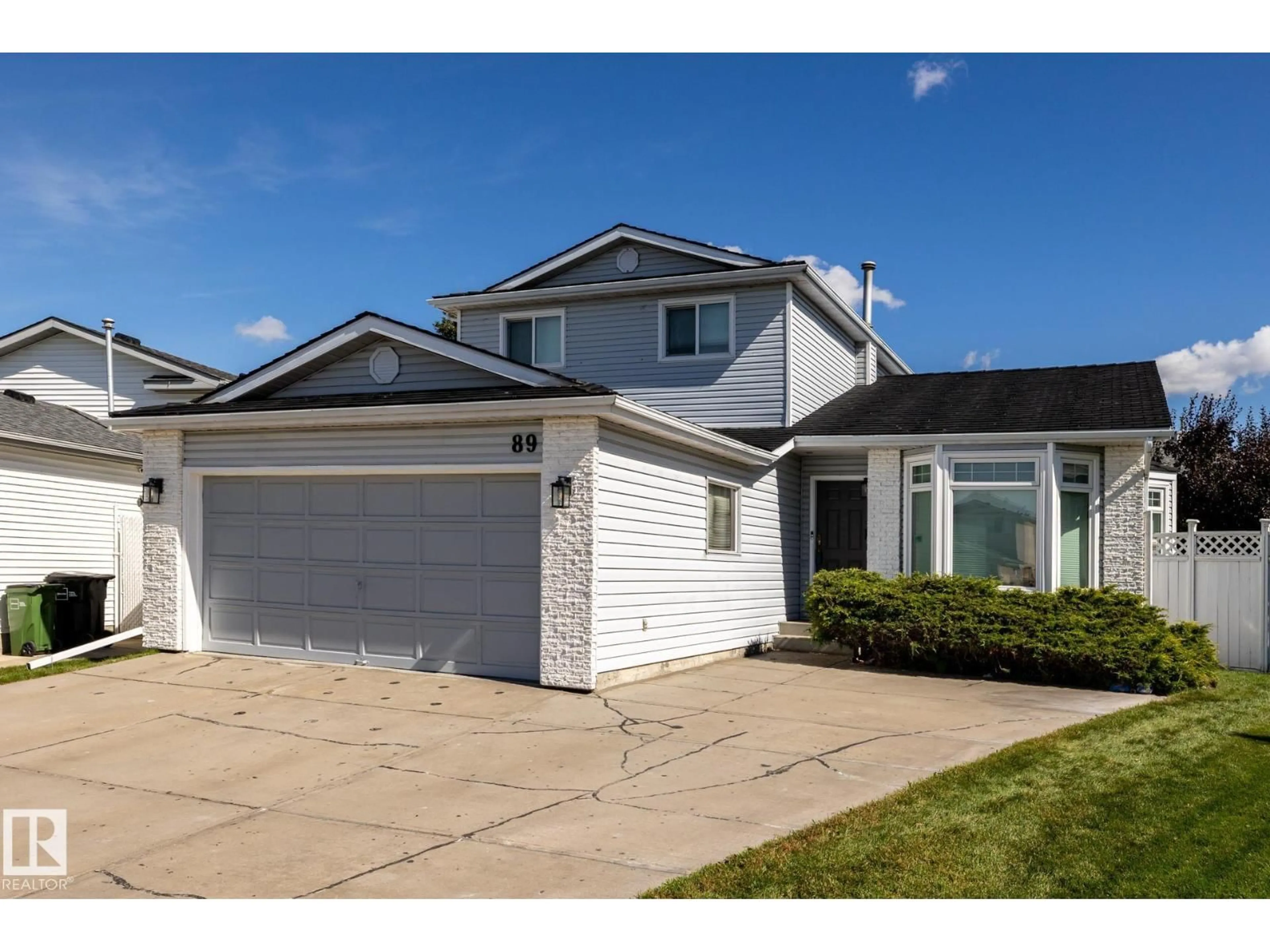 Home with vinyl exterior material, street for 89 OZERNA RD, Edmonton Alberta T5Z2Y5