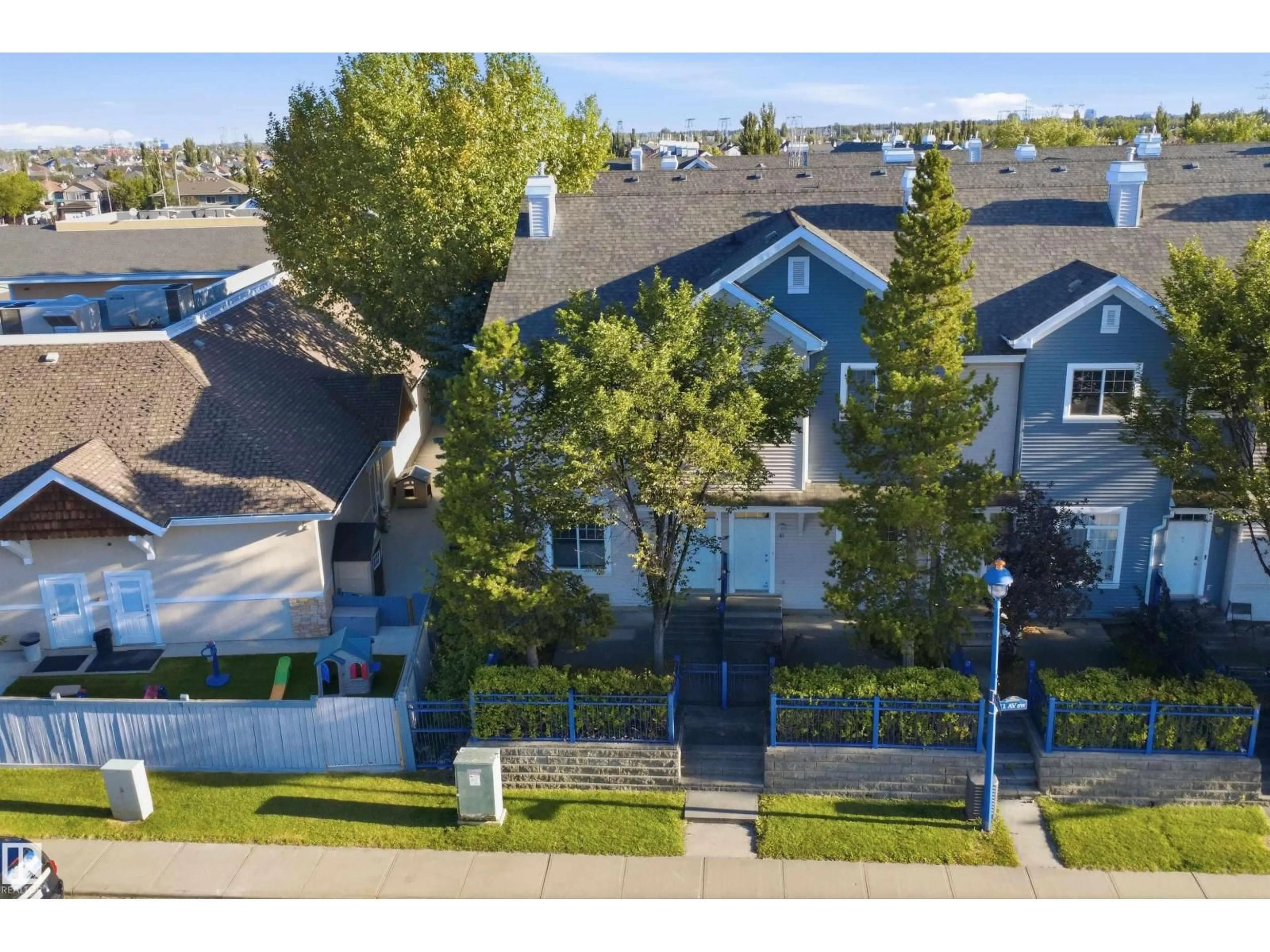 A pic from outside/outdoor area/front of a property/back of a property/a pic from drone, street for #84 - 8304 11 AV, Edmonton Alberta T6X1J8