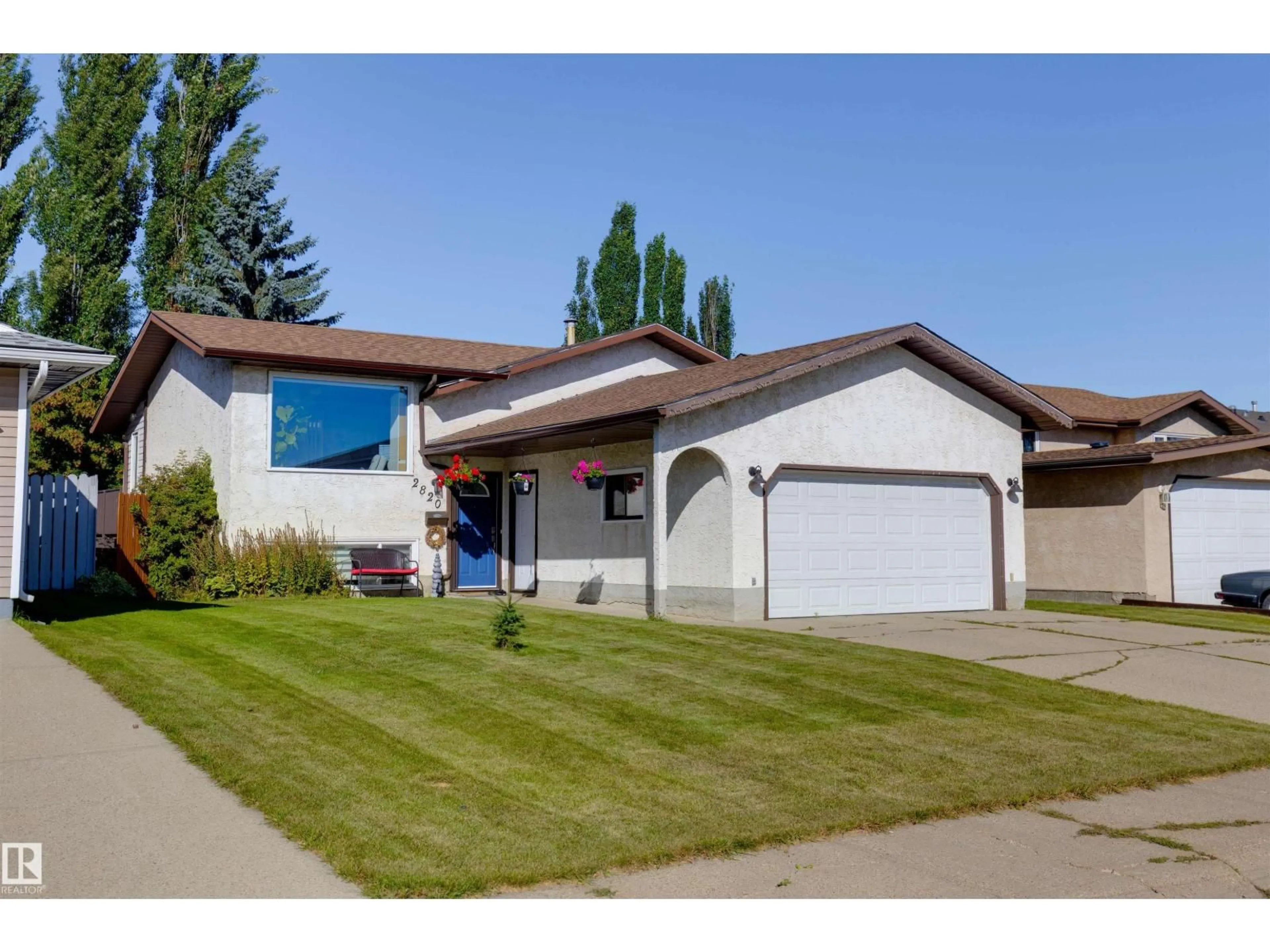 Home with vinyl exterior material, street for 2820 35 ST, Edmonton Alberta T6L3Y4