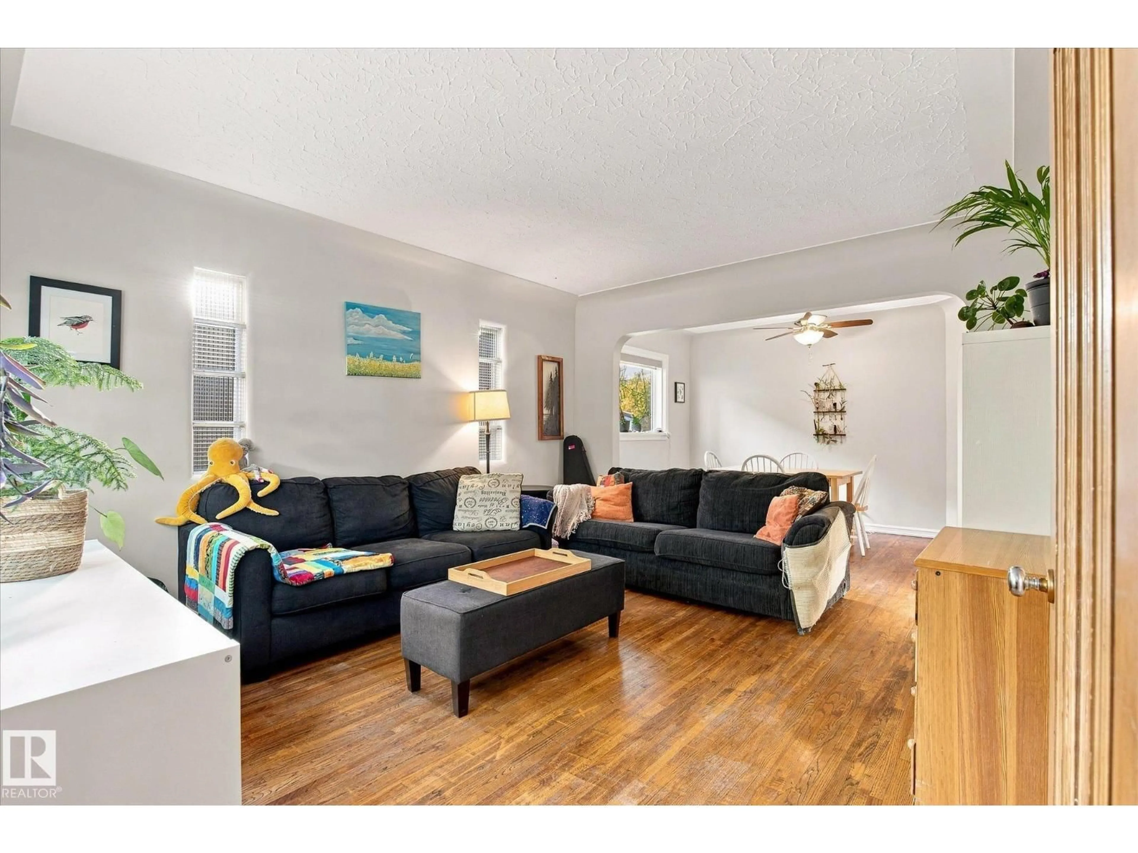 Living room with furniture, wood/laminate floor for 10943 72 AV, Edmonton Alberta T6G0B1