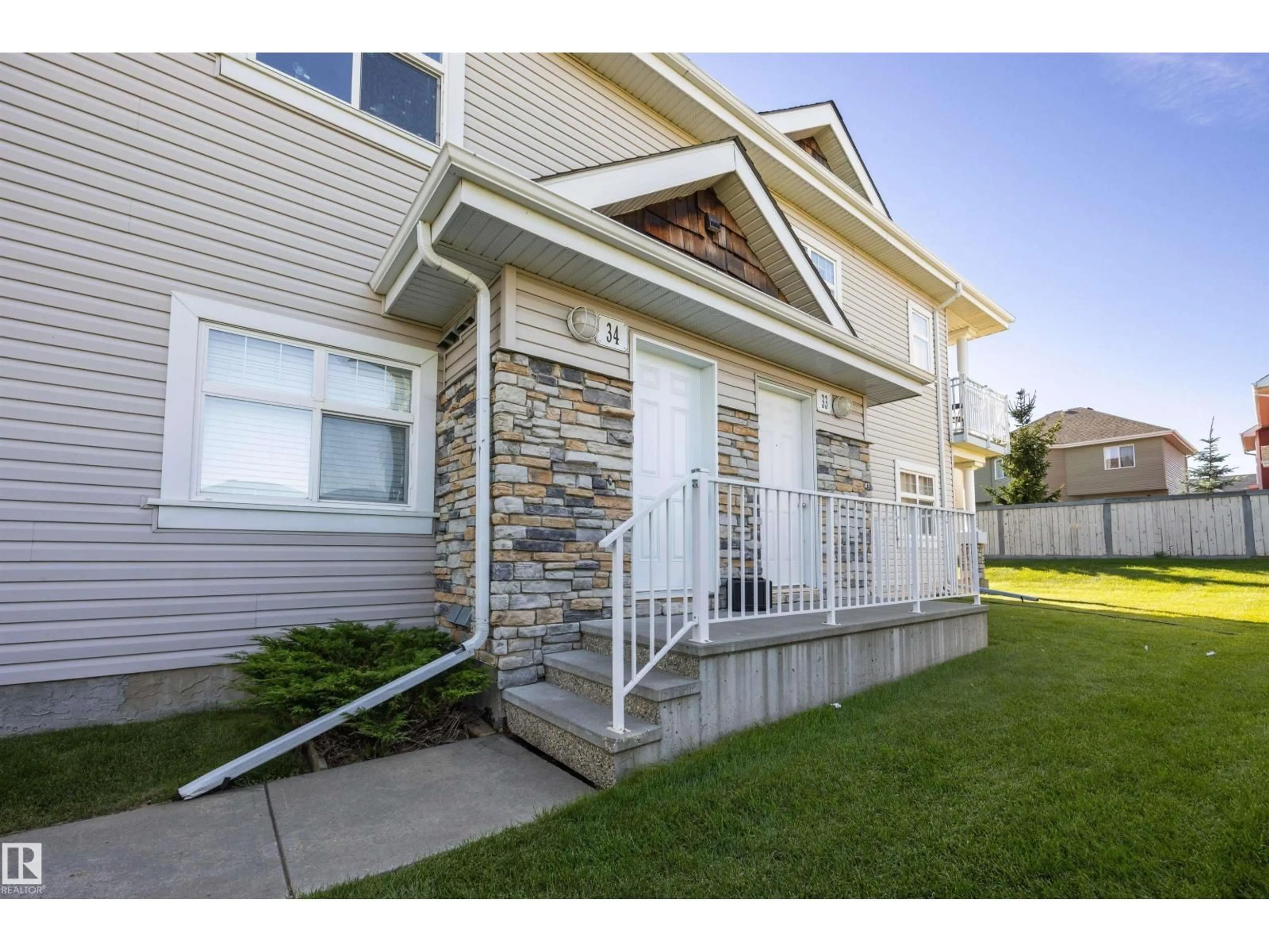 Home with vinyl exterior material, street for #34 - 3040 SPENCE WD, Edmonton Alberta T6X1N7
