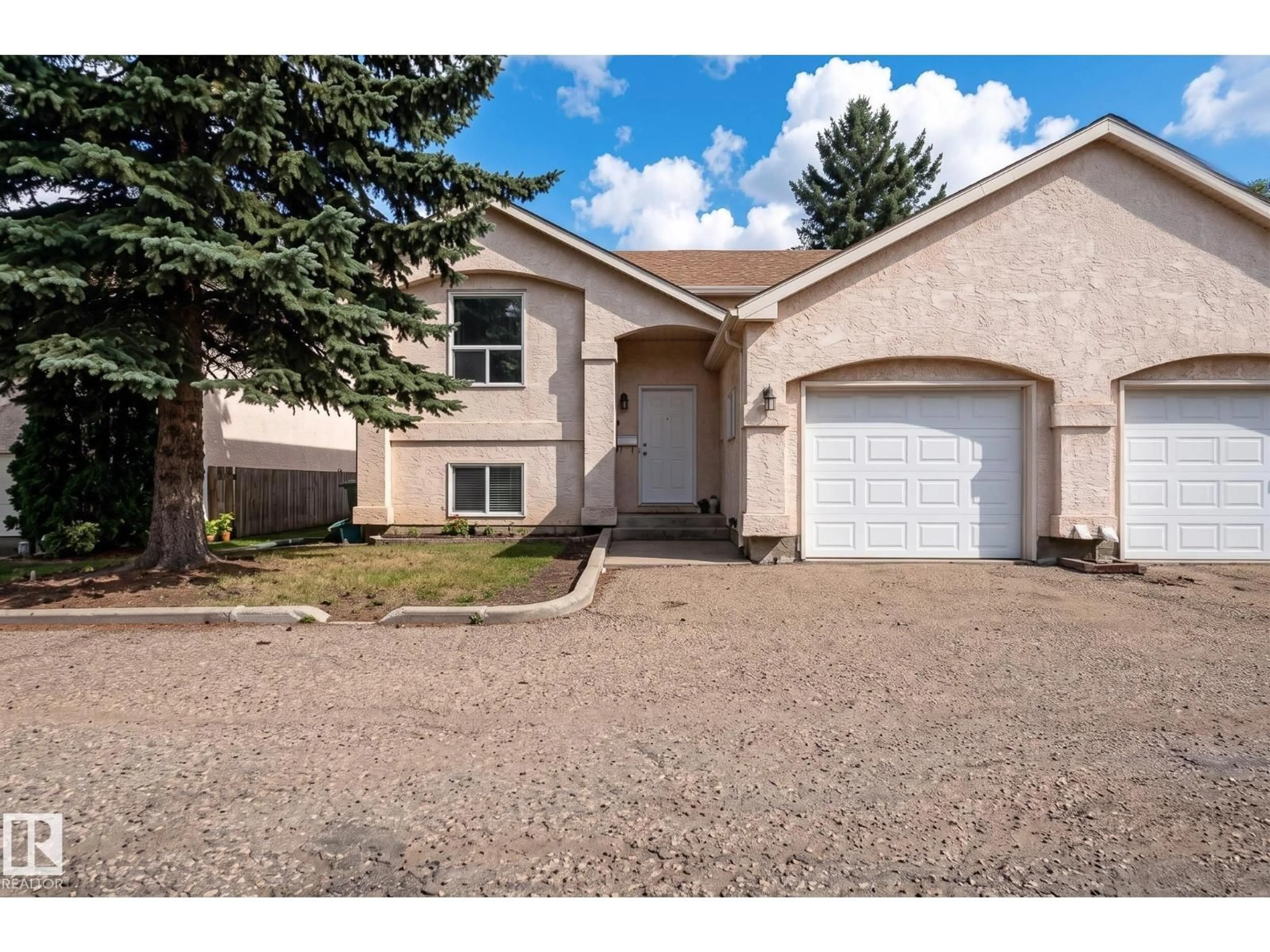 Home with vinyl exterior material, street for 1817 MILL WOODS RD E, Edmonton Alberta T6L6K2