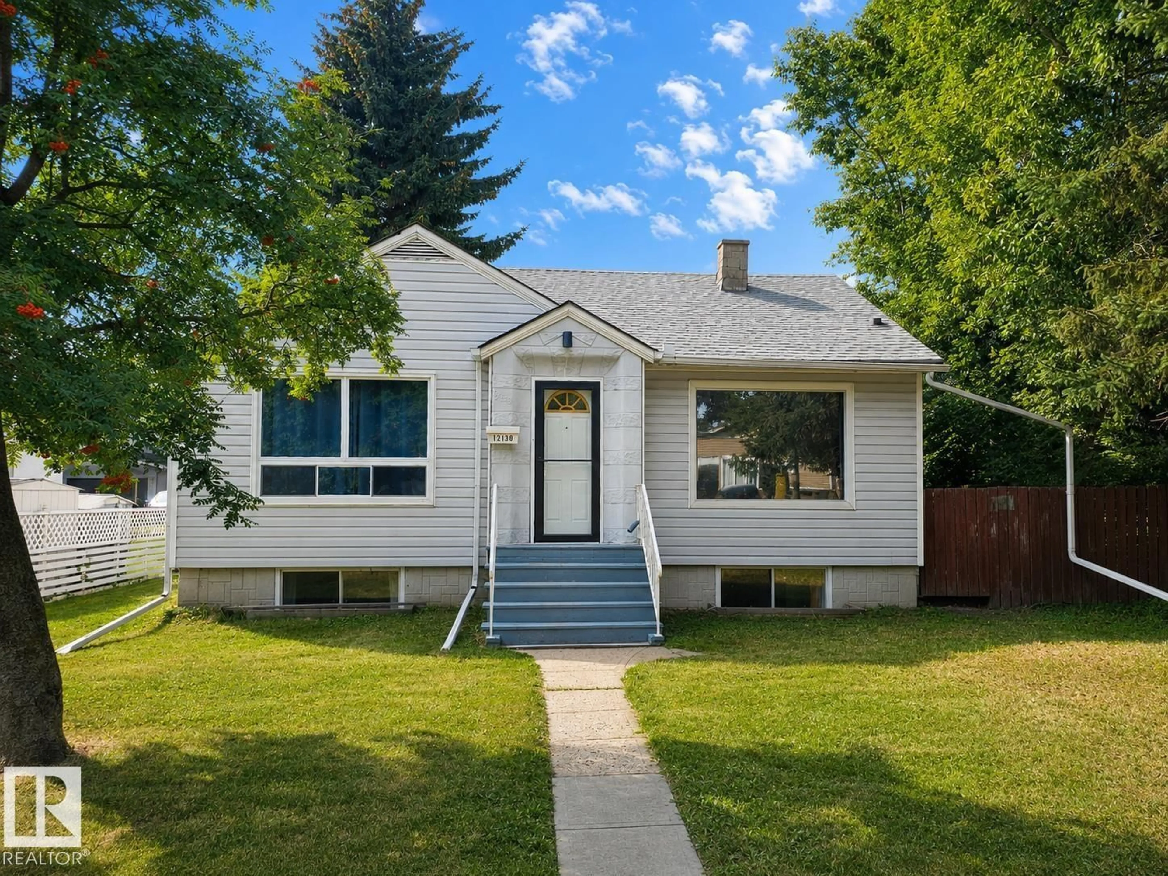 Home with vinyl exterior material, street for 12130 124 ST, Edmonton Alberta T5L0M9