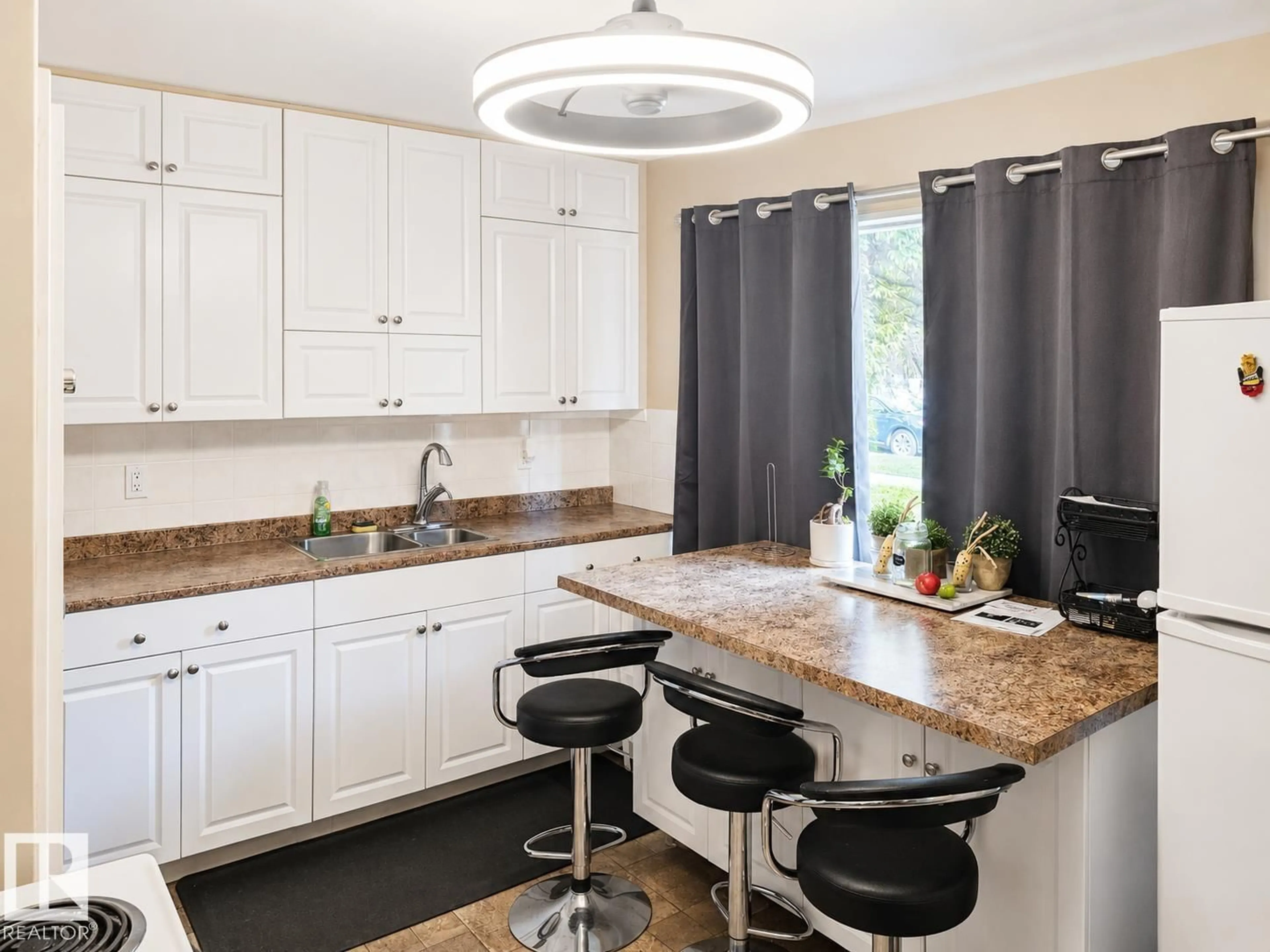 Open concept kitchen, ceramic/tile floor for 12130 124 ST, Edmonton Alberta T5L0M9