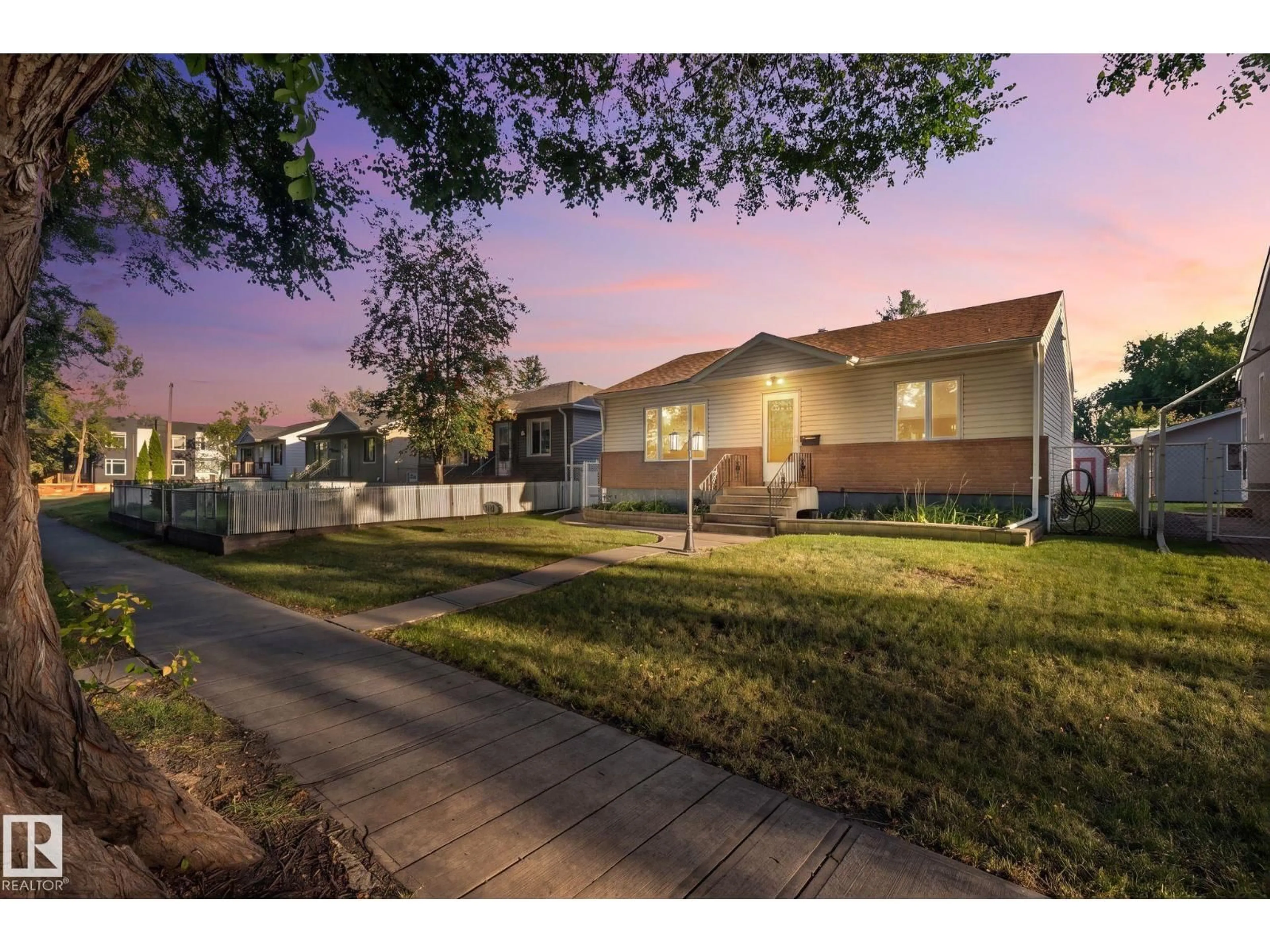 A pic from outside/outdoor area/front of a property/back of a property/a pic from drone, street for 9719 65 AV, Edmonton Alberta T6E0K5