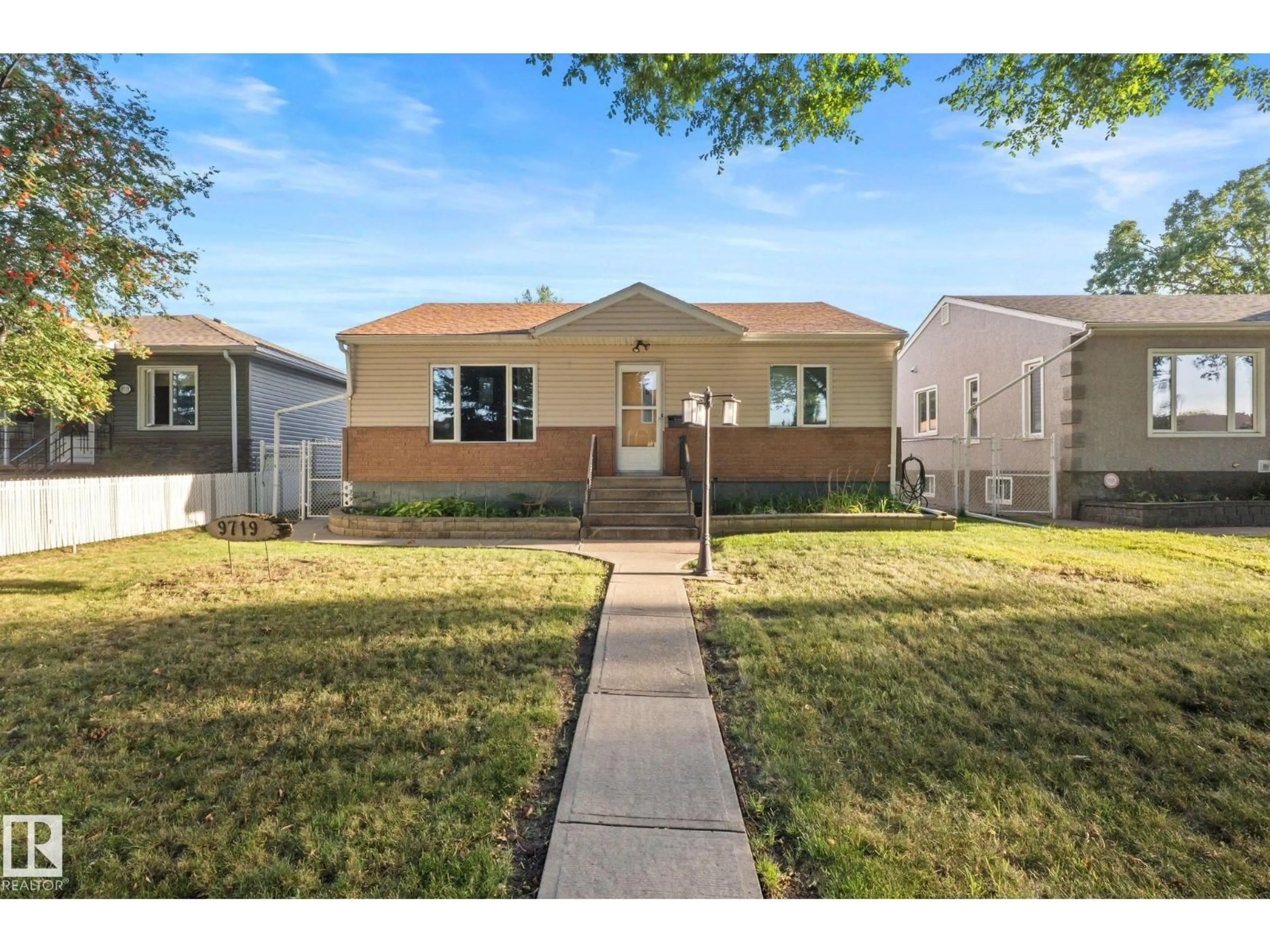 Home with vinyl exterior material, street for 9719 65 AV, Edmonton Alberta T6E0K5