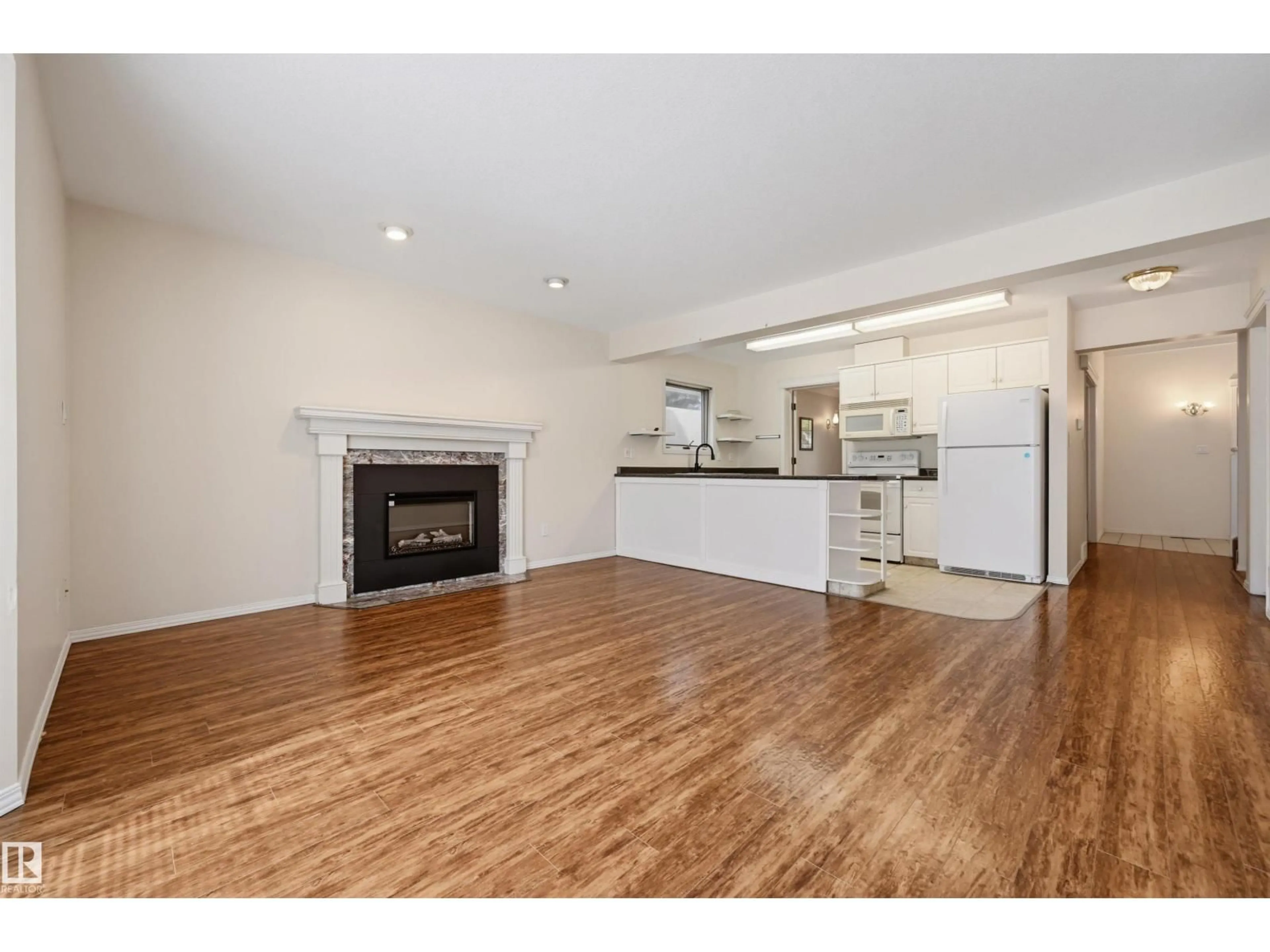 Open concept kitchen, wood/laminate floor for 11107 UNIVERSITY AV, Edmonton Alberta T6G1Y5