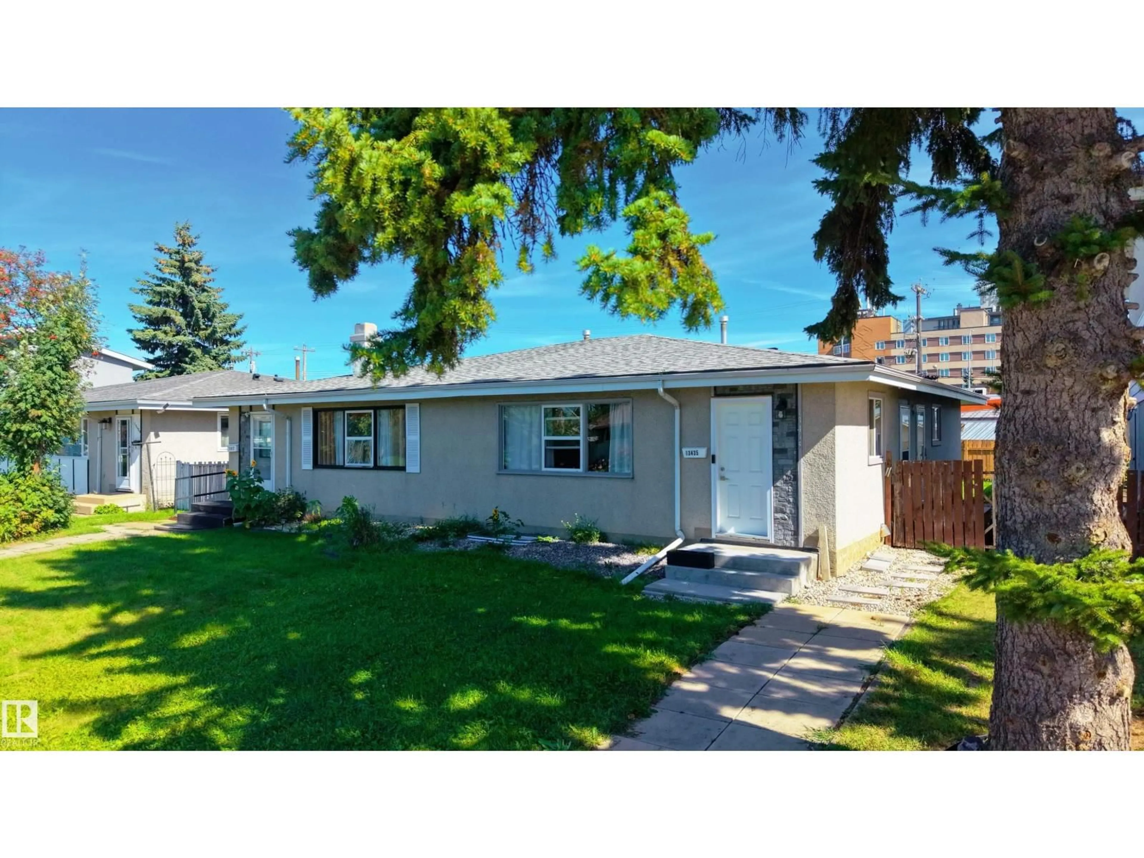 Home with vinyl exterior material, street for 13435 101 ST, Edmonton Alberta T5E4G5