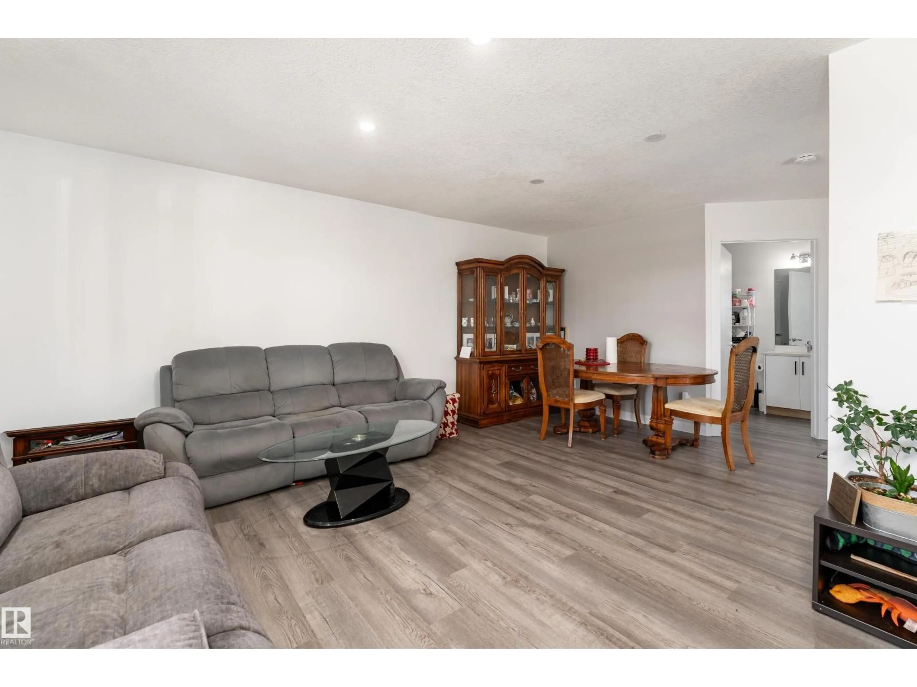 Living room with furniture, wood/laminate floor for 13435 101 ST, Edmonton Alberta T5E4G5