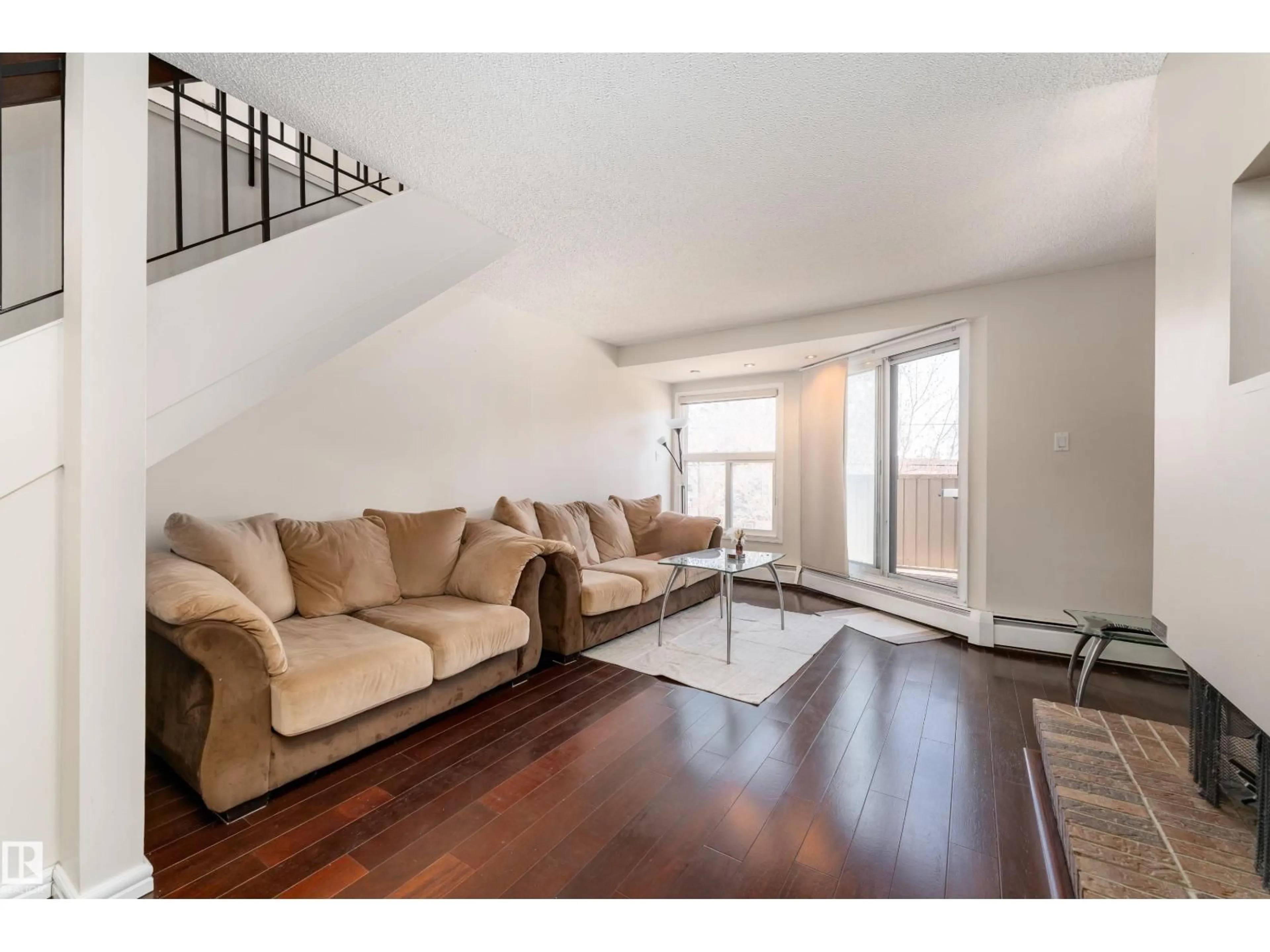 Living room with furniture, wood/laminate floor for 11120 83 AV, Edmonton Alberta T6G0V1