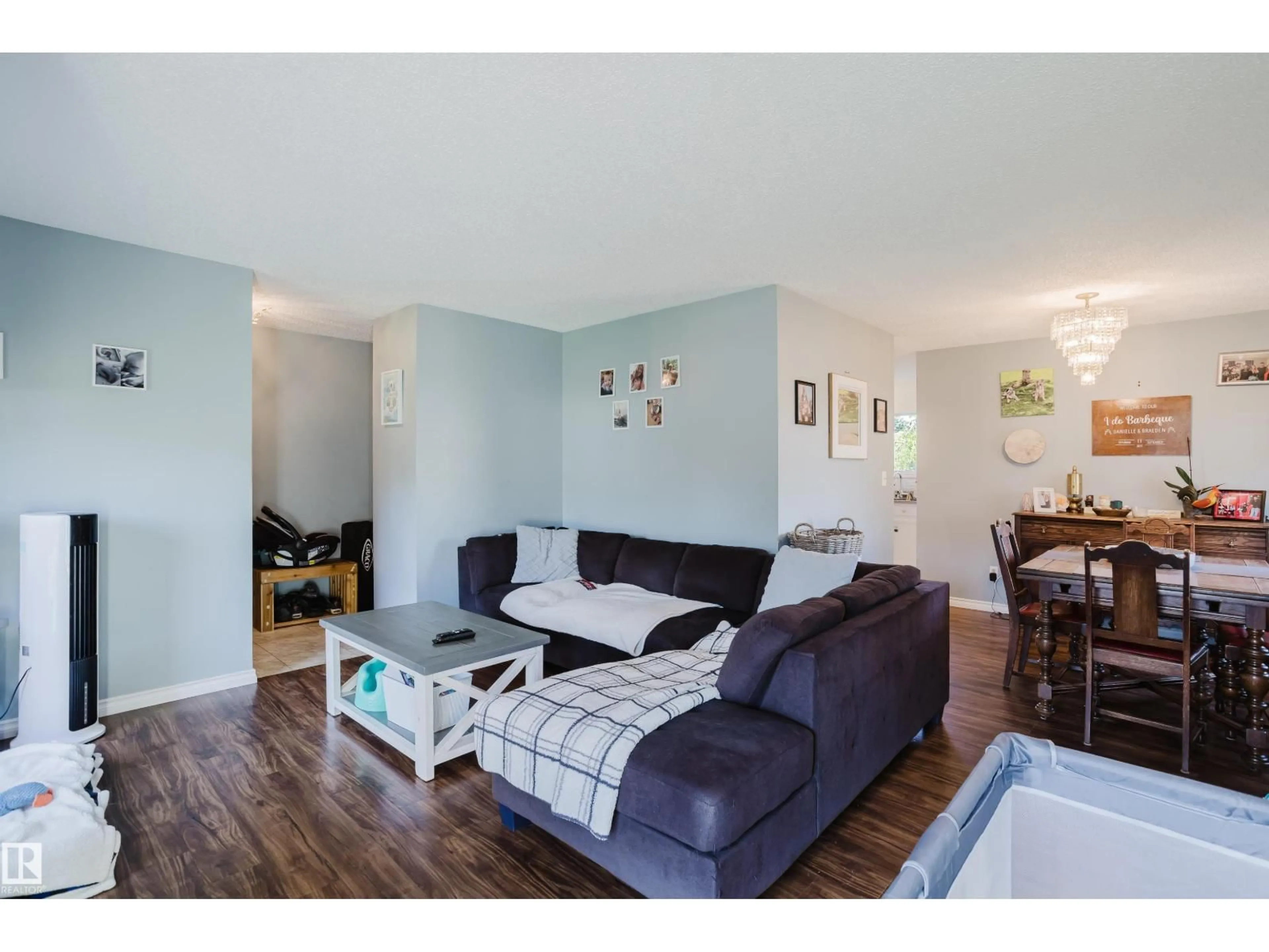 Living room with furniture, wood/laminate floor for NW - 15256 122 ST, Edmonton Alberta T5X1P5