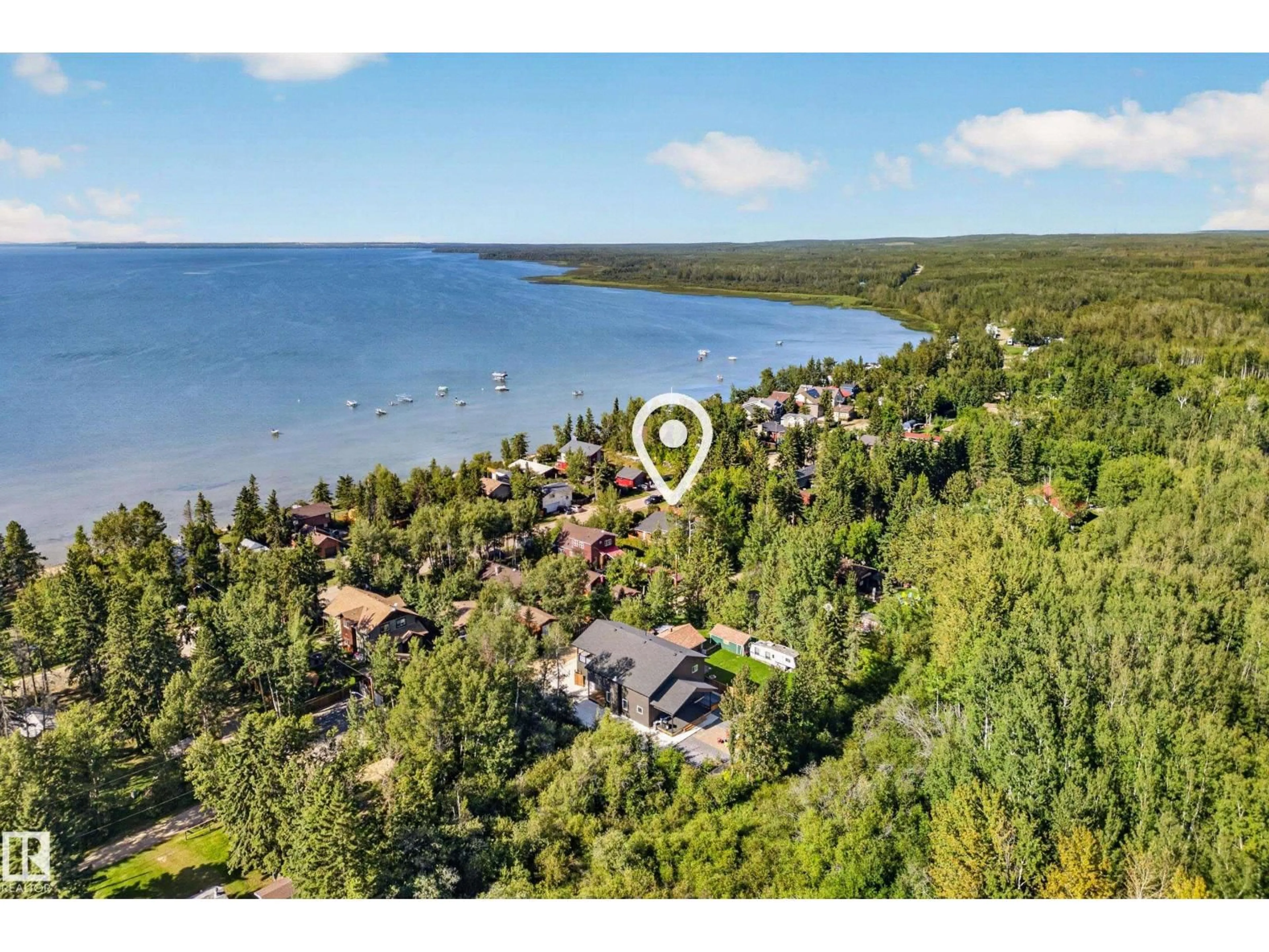 A pic from outside/outdoor area/front of a property/back of a property/a pic from drone, water/lake/river/ocean view for 208 1 AV, Rural Wetaskiwin County Alberta T0C1X0