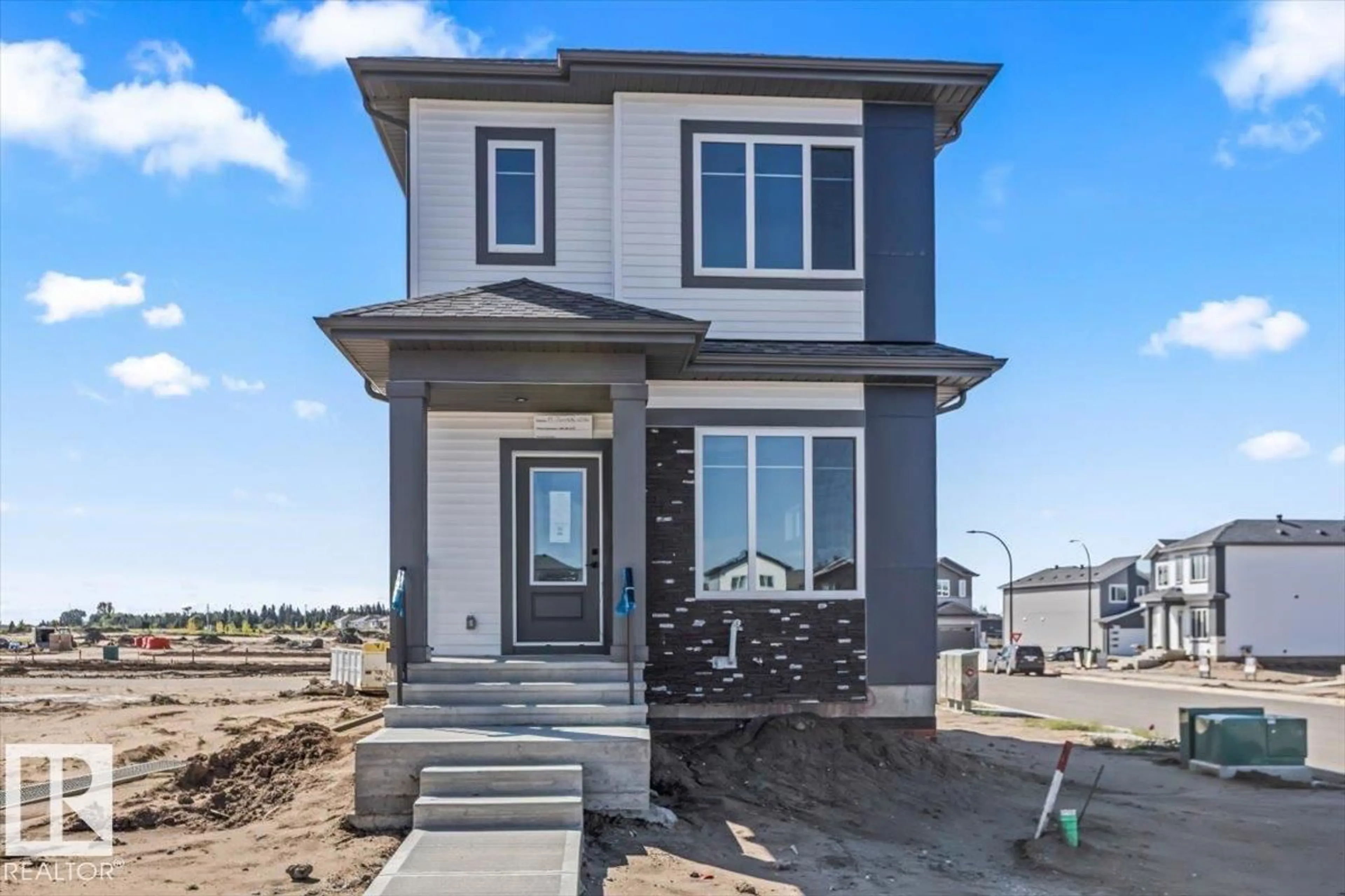 Home with vinyl exterior material, street for 61 JUNIPER WD, Fort Saskatchewan Alberta T8L3S4