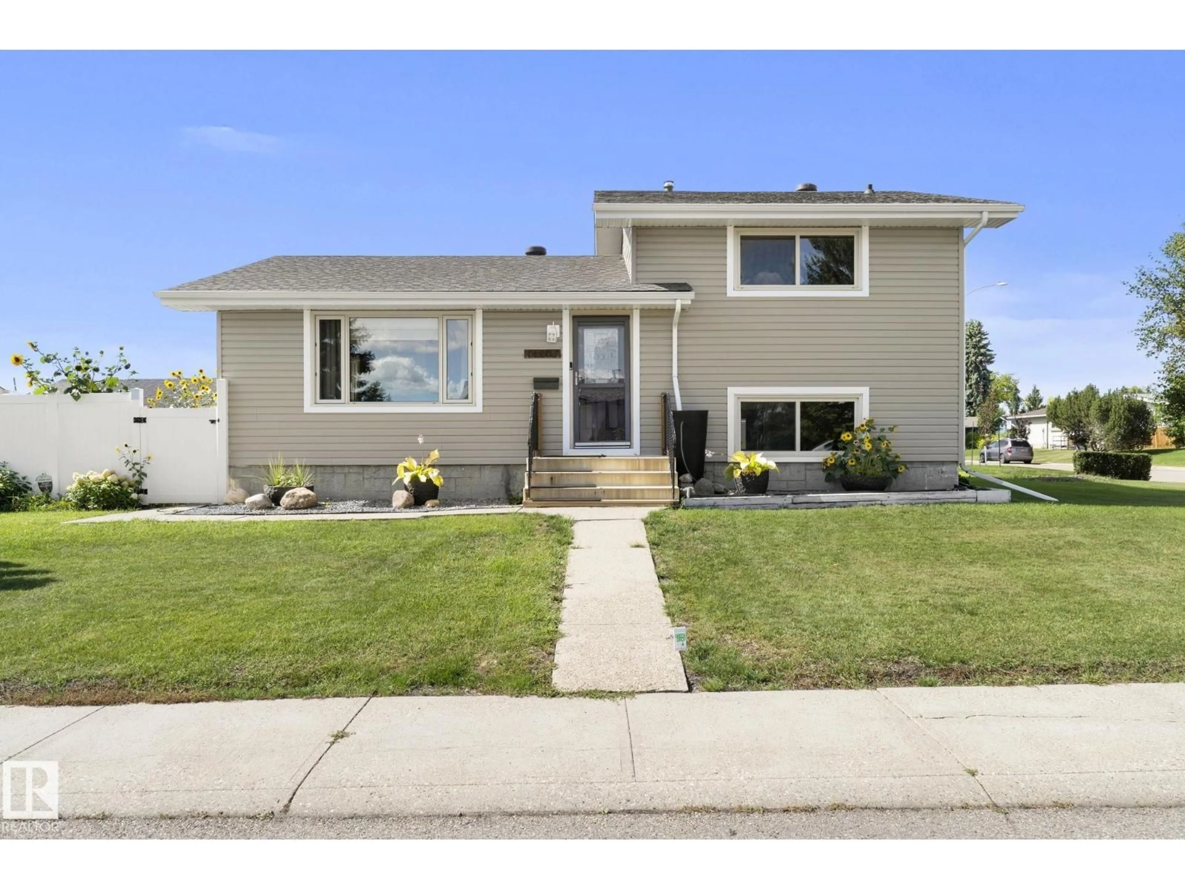 Home with vinyl exterior material, street for 14402 64 ST, Edmonton Alberta T5A2C1