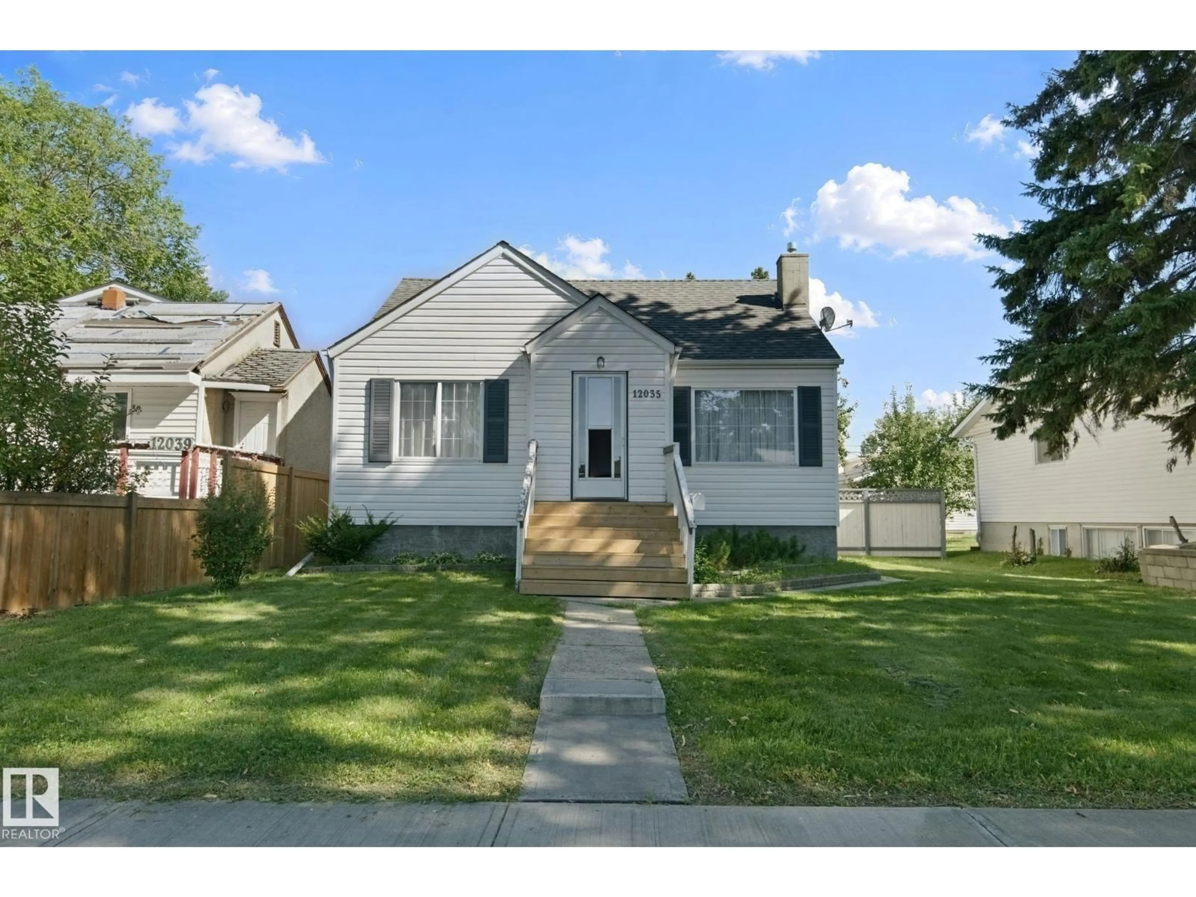 Home with vinyl exterior material, street for NW - 12035 83 ST, Edmonton Alberta T5B2Z7