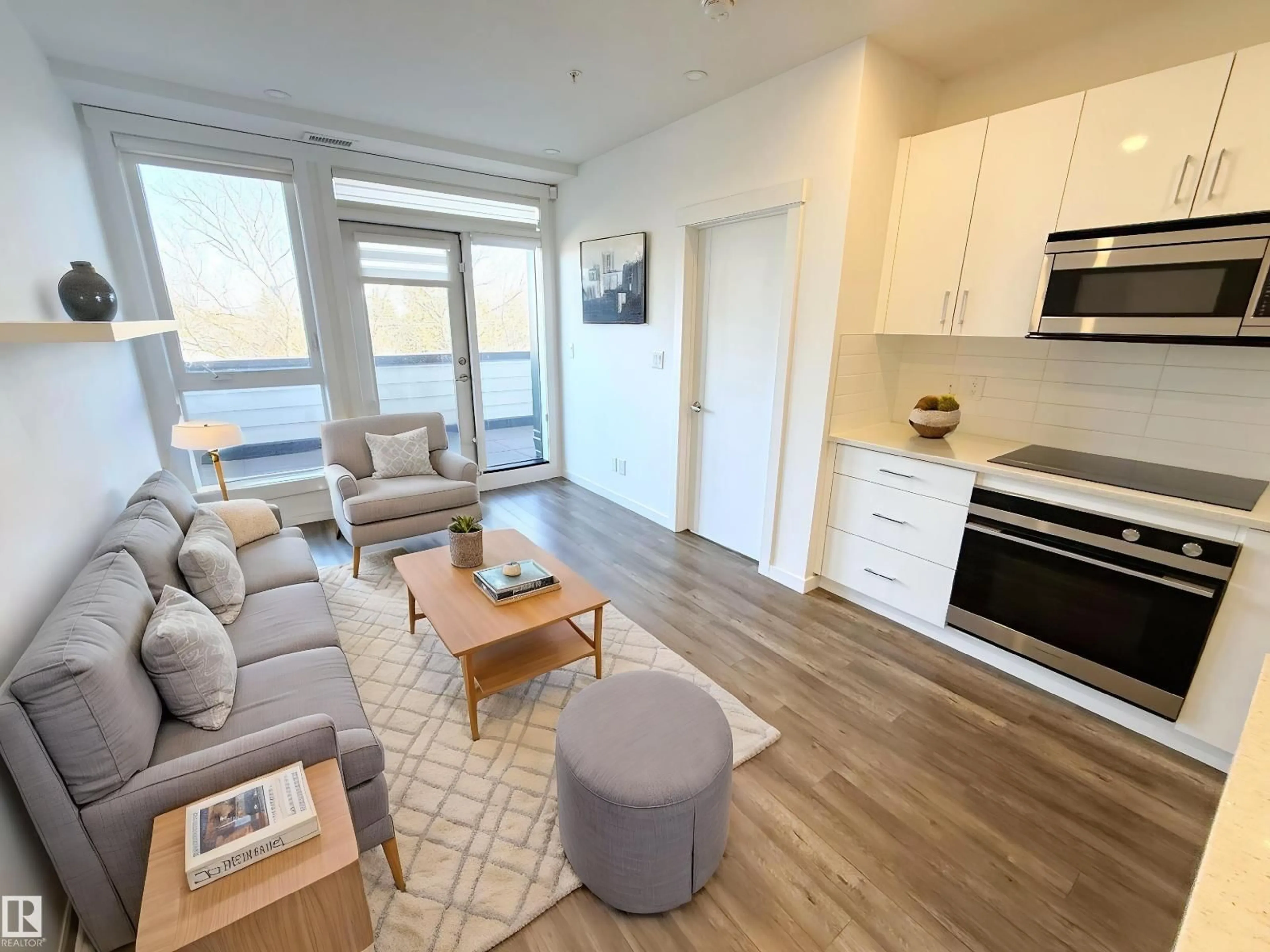 Living room with furniture, wood/laminate floor for 405 - 11503 76 AV, Edmonton Alberta T6G0K6