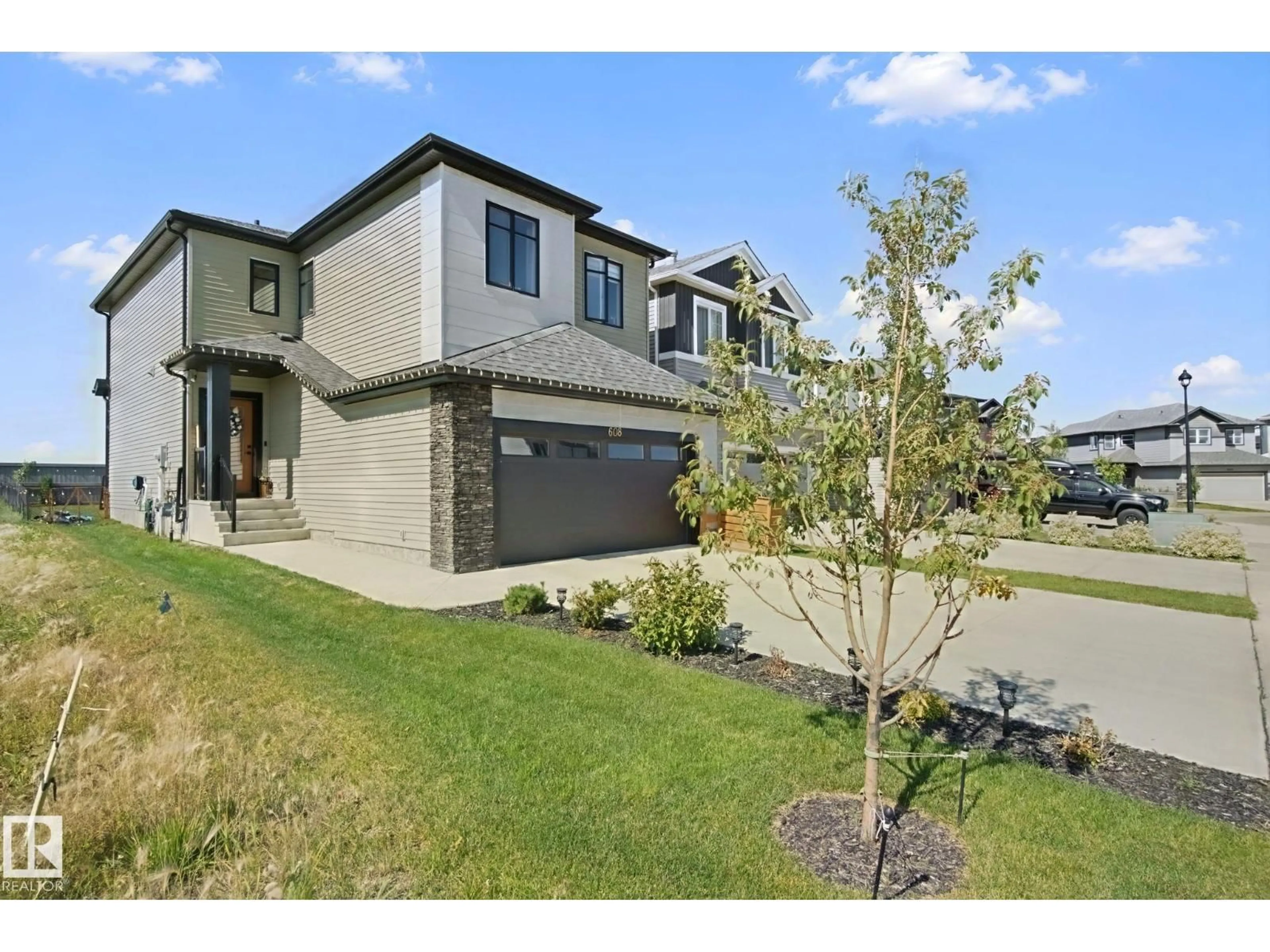 Home with brick exterior material, street for 608 BOULDER WD, Leduc Alberta T9E1M1