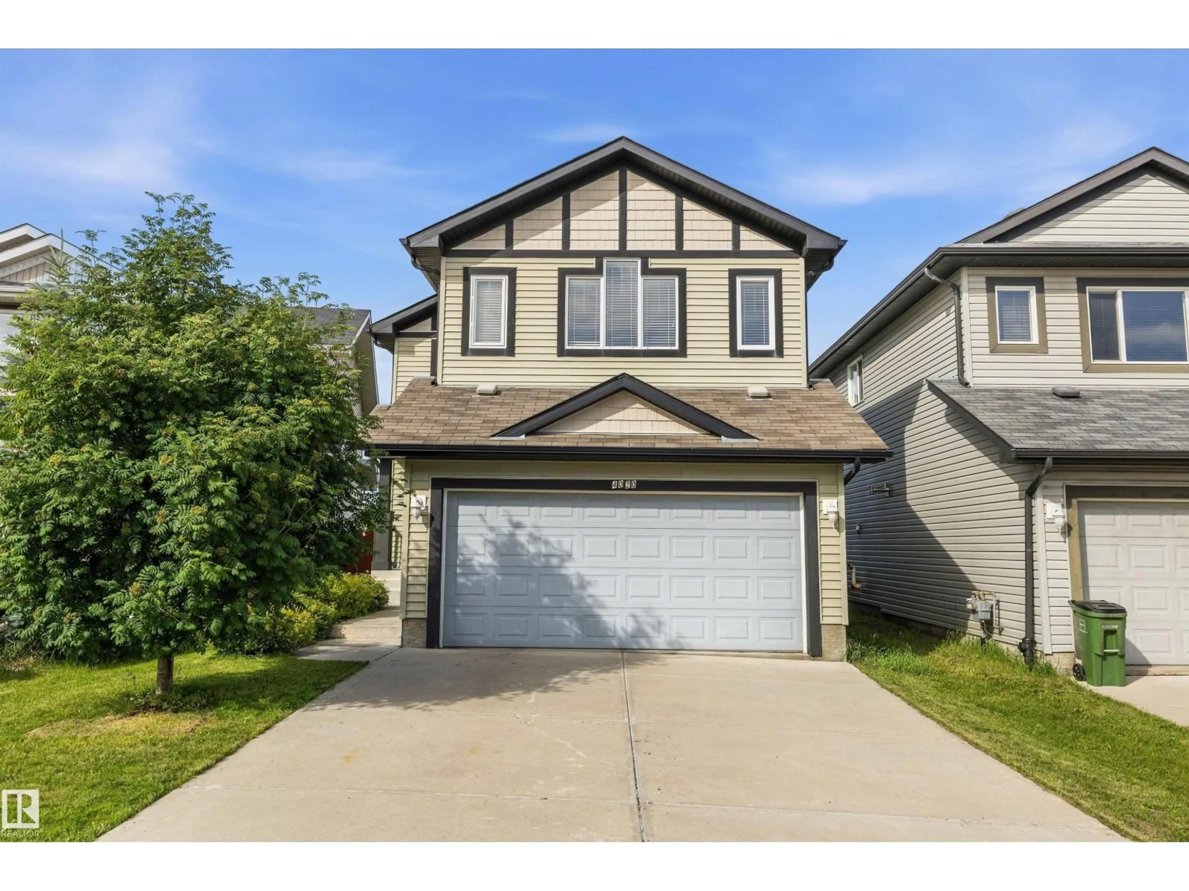 Home with vinyl exterior material, street for 4020 166 AV, Edmonton Alberta T5Y0N9