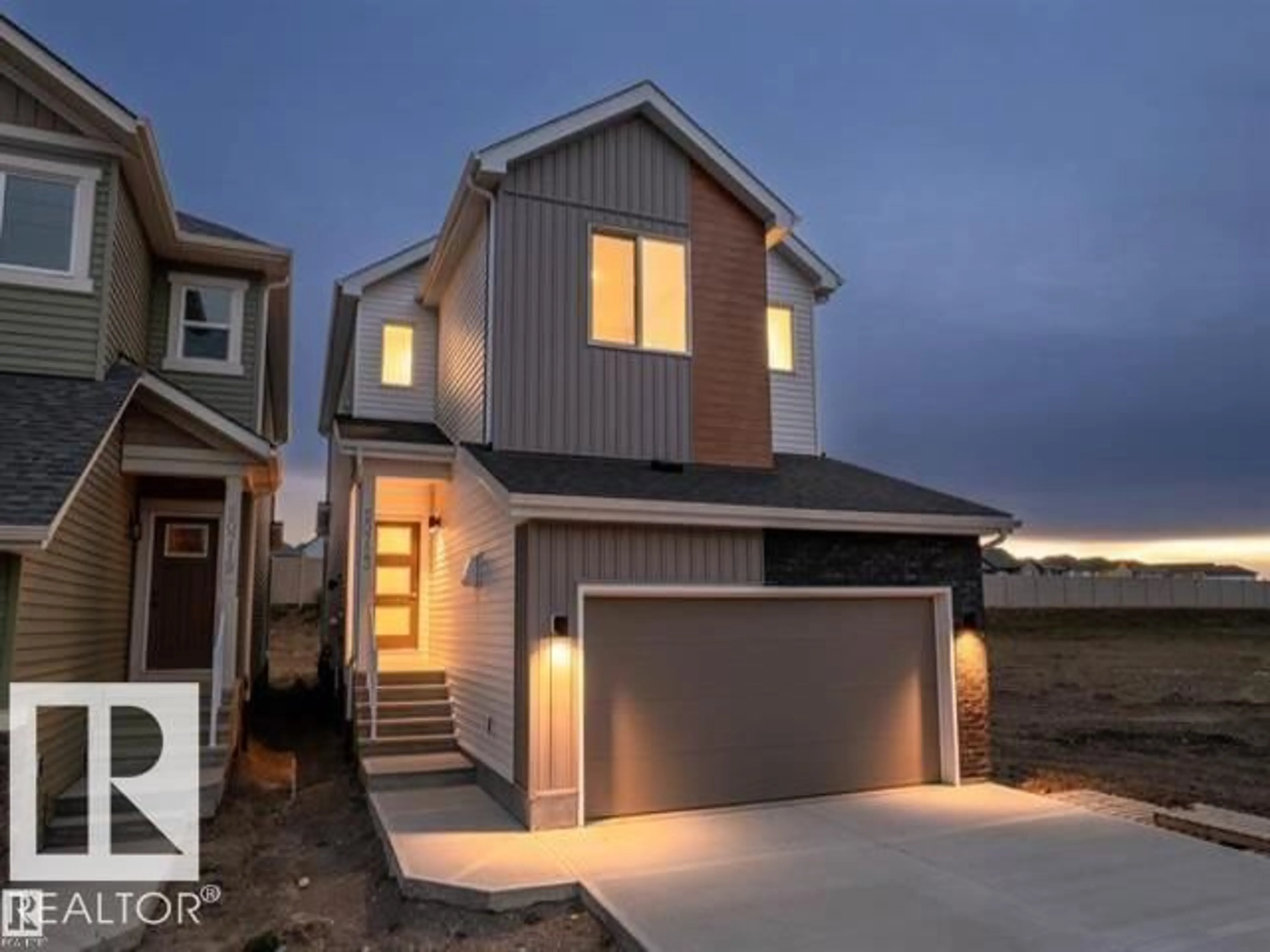 Home with vinyl exterior material, street for 20723 24 AV, Edmonton Alberta T6M2C4