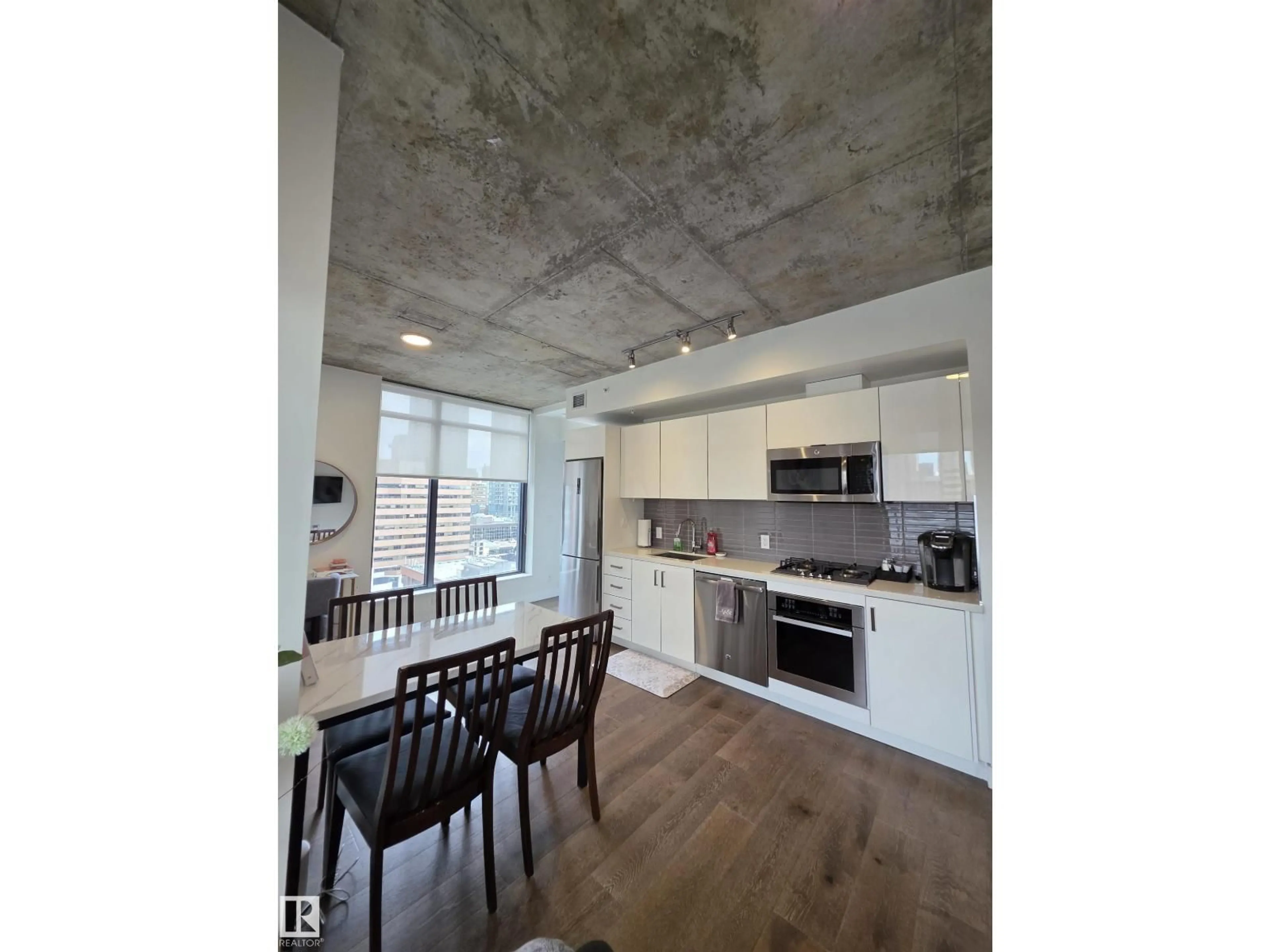 Open concept kitchen, cement floor for 1010 - 1006 6 ST, Calgary Alberta T2R1B4