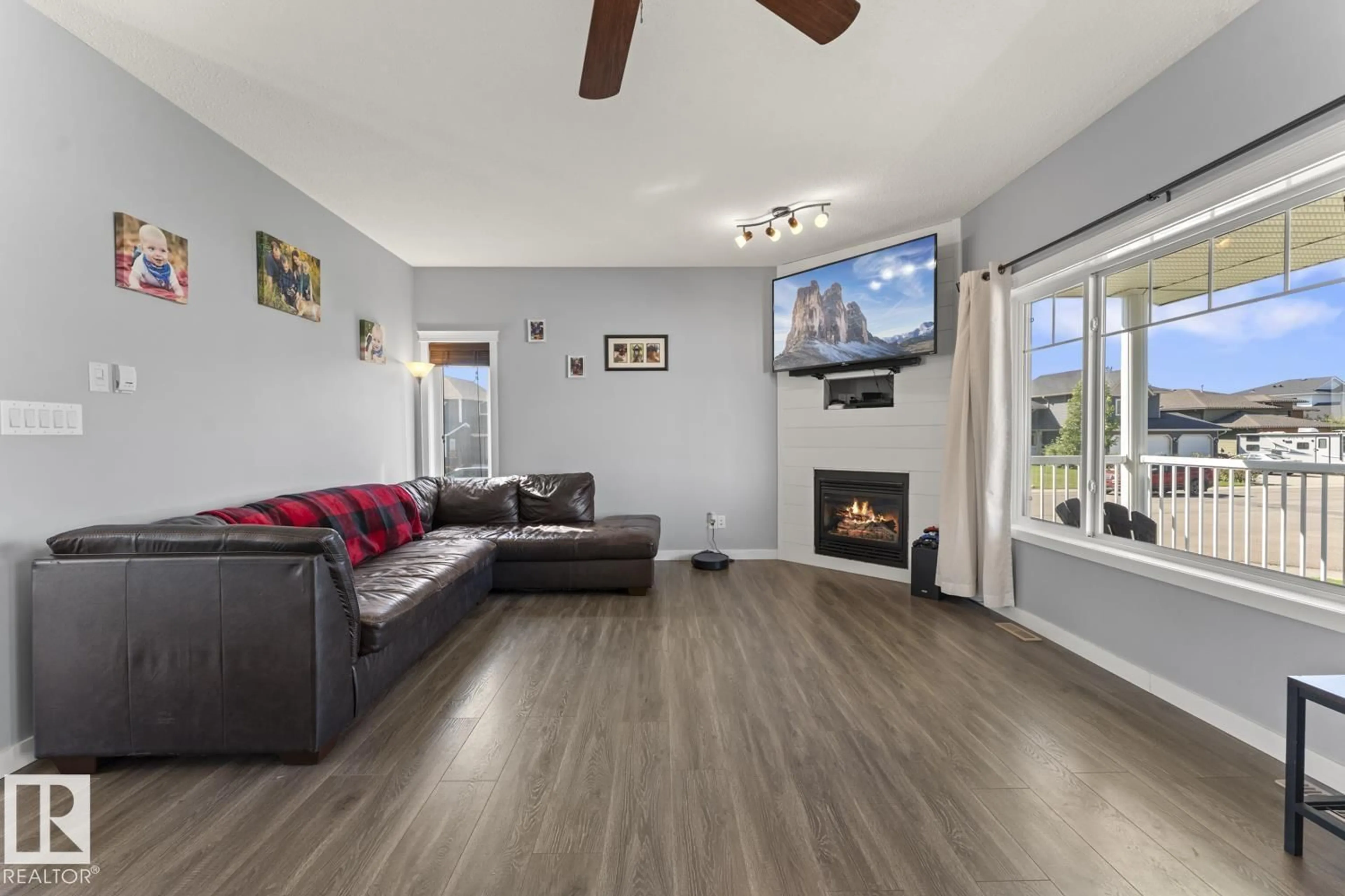 Living room with furniture, wood/laminate floor for 501 26 ST, Cold Lake Alberta T9M0B2