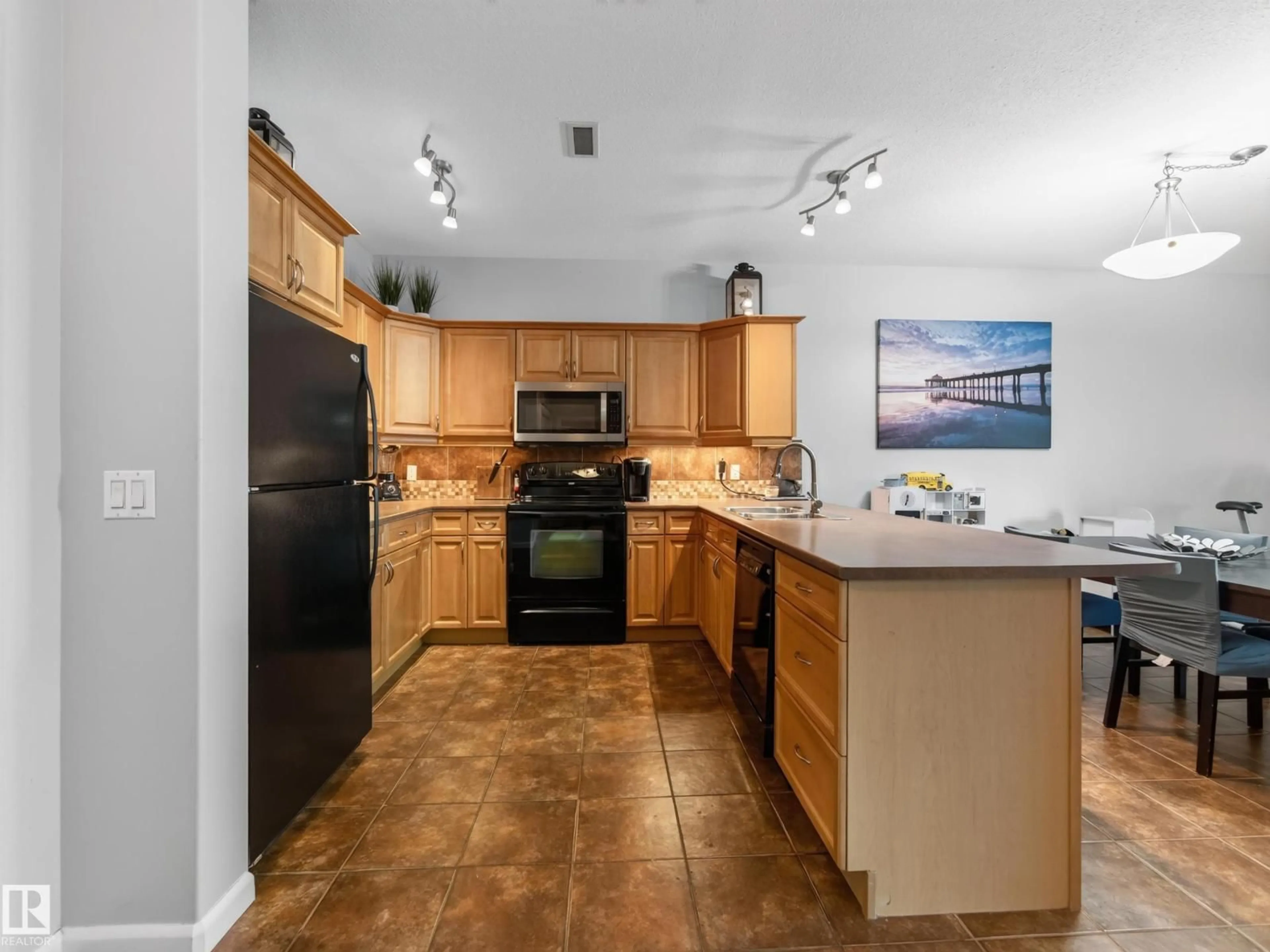 Open concept kitchen, ceramic/tile floor for 160 - 332 MAGRATH RD, Edmonton Alberta T6R3T7