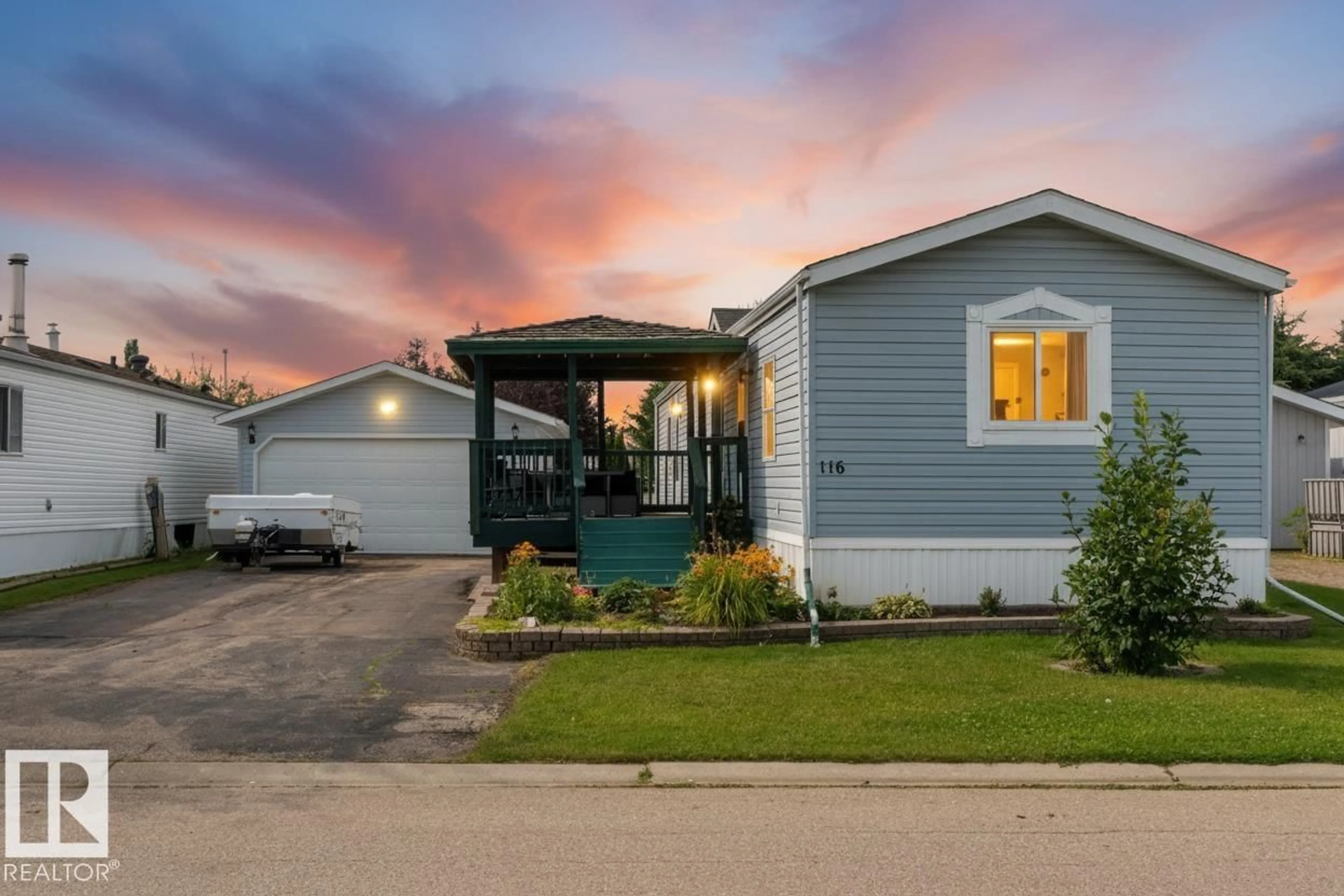 Home with vinyl exterior material, street for 116 3400 48 ST, Stony Plain Alberta T7Z1V9