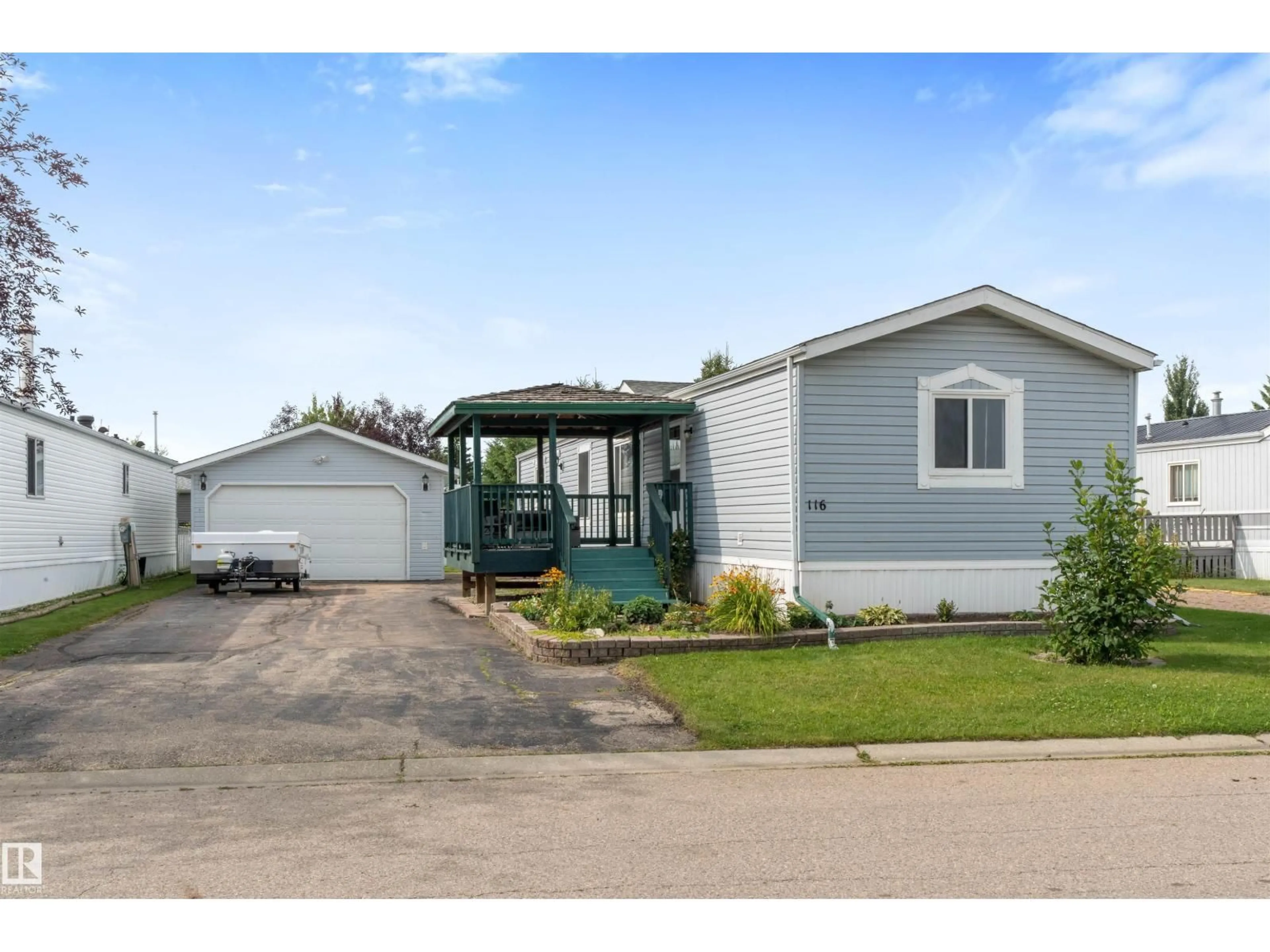 Home with vinyl exterior material, street for 116 3400 48 ST, Stony Plain Alberta T7Z1V9