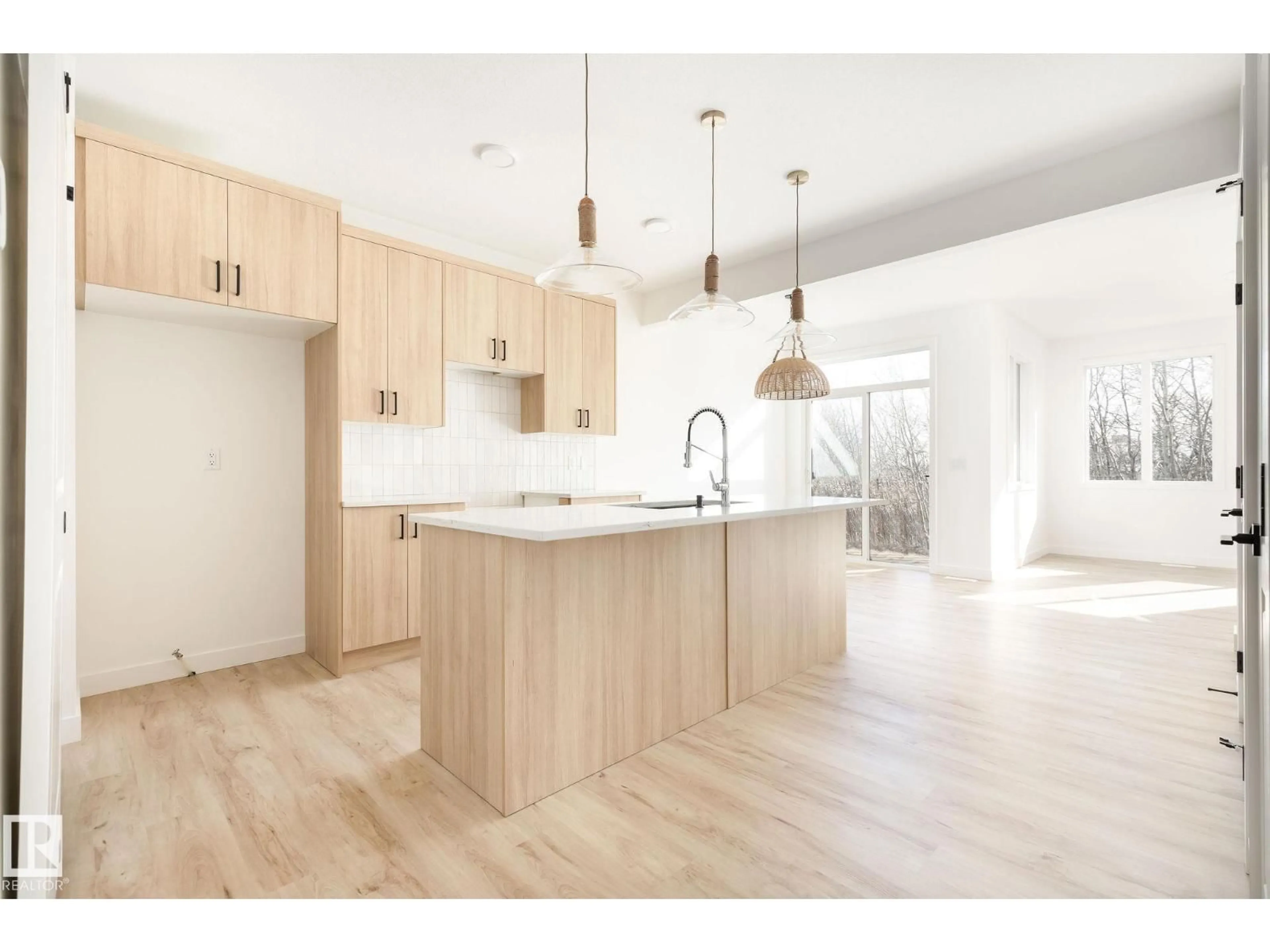 Open concept kitchen, wood/laminate floor for 2619 62 ST, Edmonton Alberta T6X3G3