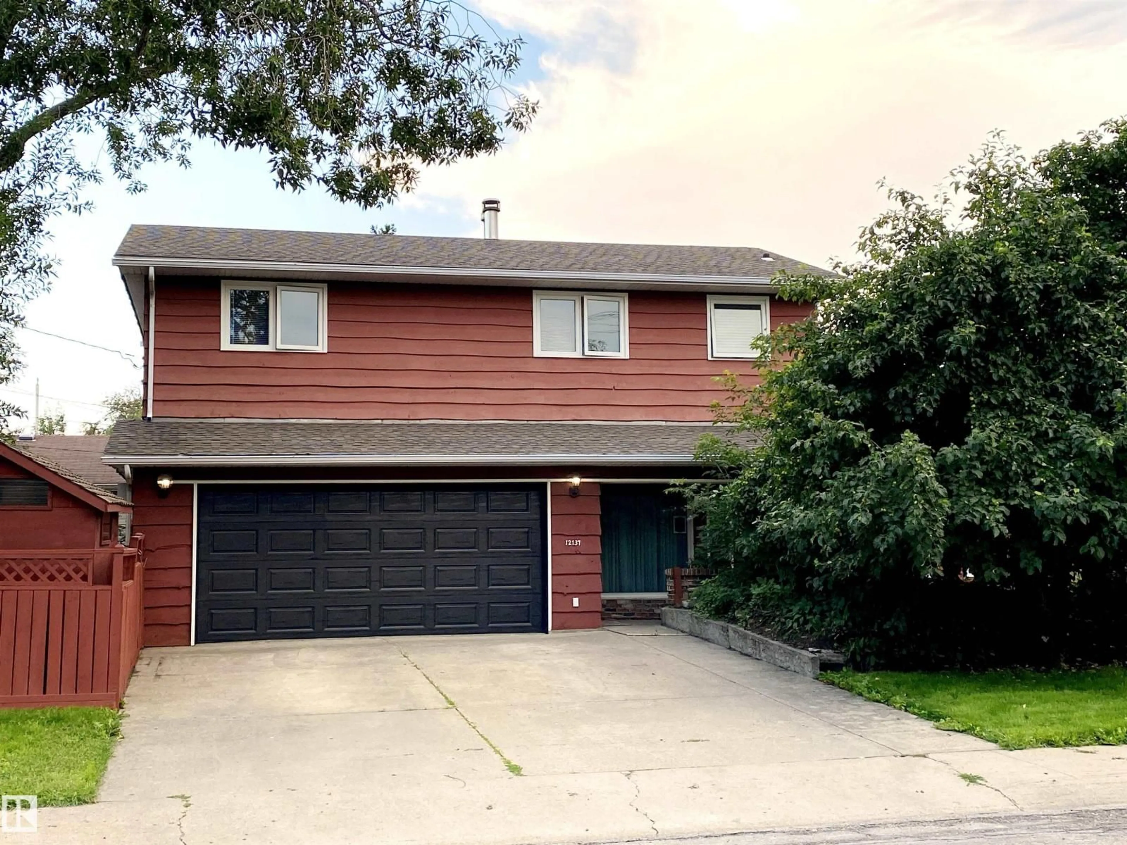 Home with vinyl exterior material, street for NW - 12137 50 ST, Edmonton Alberta T5W3C6