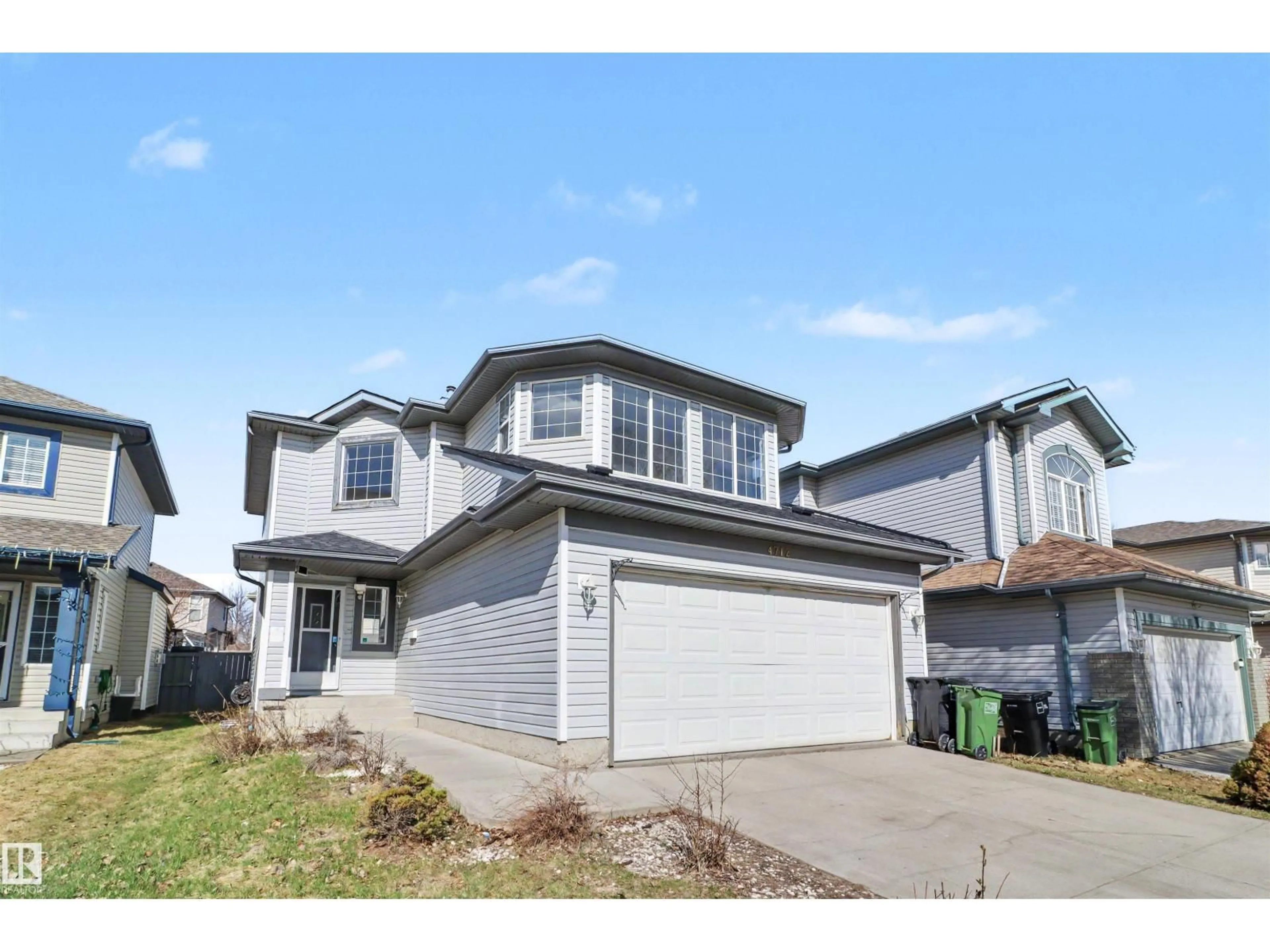 Home with vinyl exterior material, street for 4712 201 ST, Edmonton Alberta T6M2X7