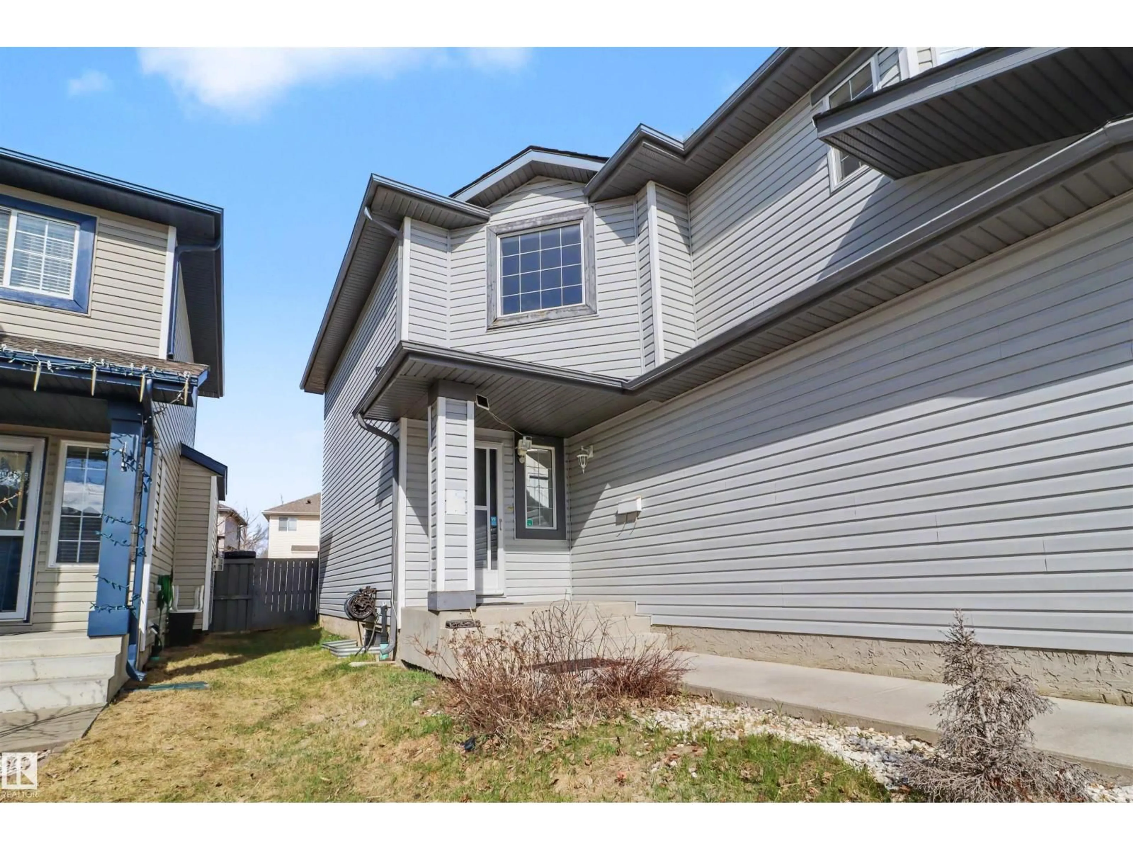 Home with vinyl exterior material, street for 4712 201 ST, Edmonton Alberta T6M2X7