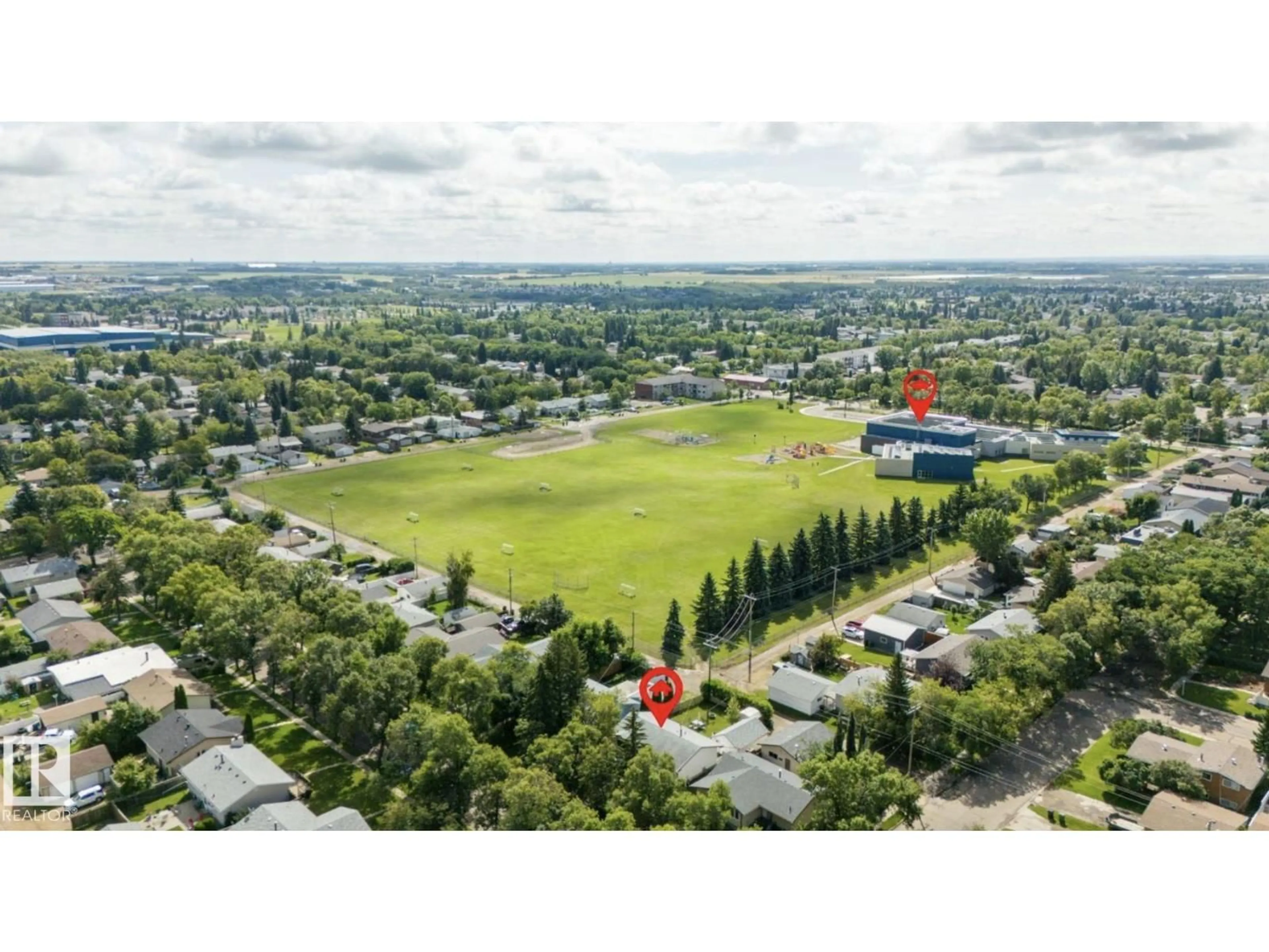 A pic from outside/outdoor area/front of a property/back of a property/a pic from drone, mountain view for 6221 44B AVENUE, Camrose Alberta T4V0B5