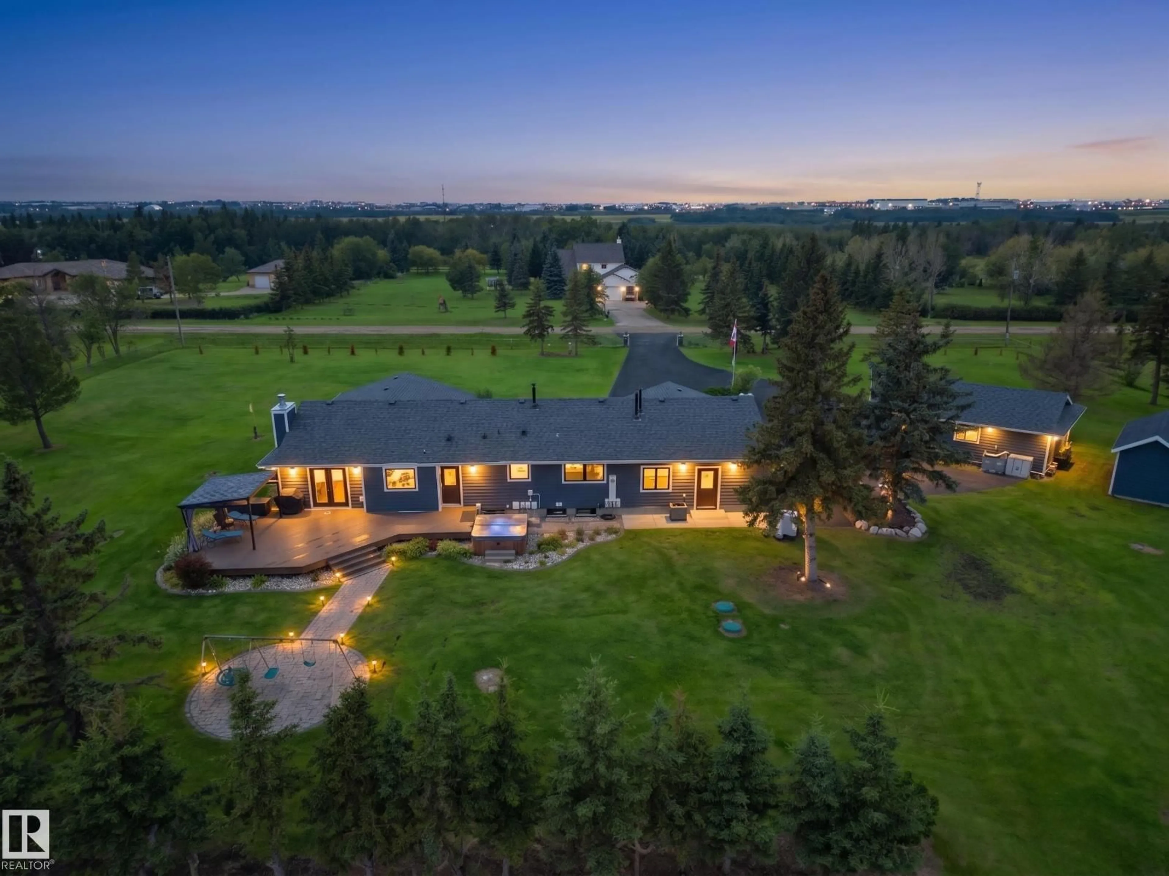 A pic from outside/outdoor area/front of a property/back of a property/a pic from drone, unknown for 1150 50242 RGE RD 244A, Rural Leduc County Alberta T4X0P4
