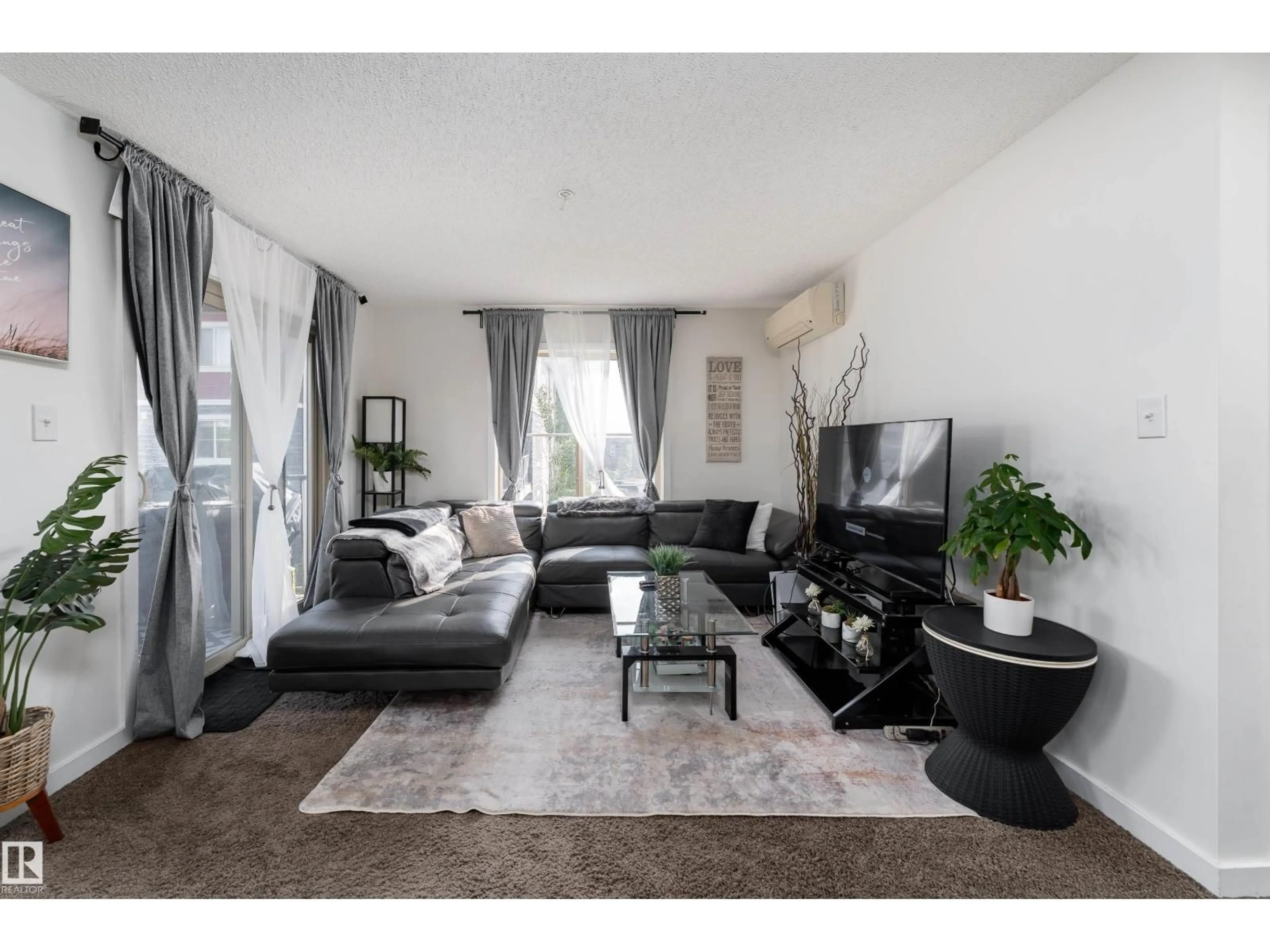 Living room with furniture, unknown for 1060 - 317 MCCONACHIE BV, Edmonton Alberta T5Y0W9