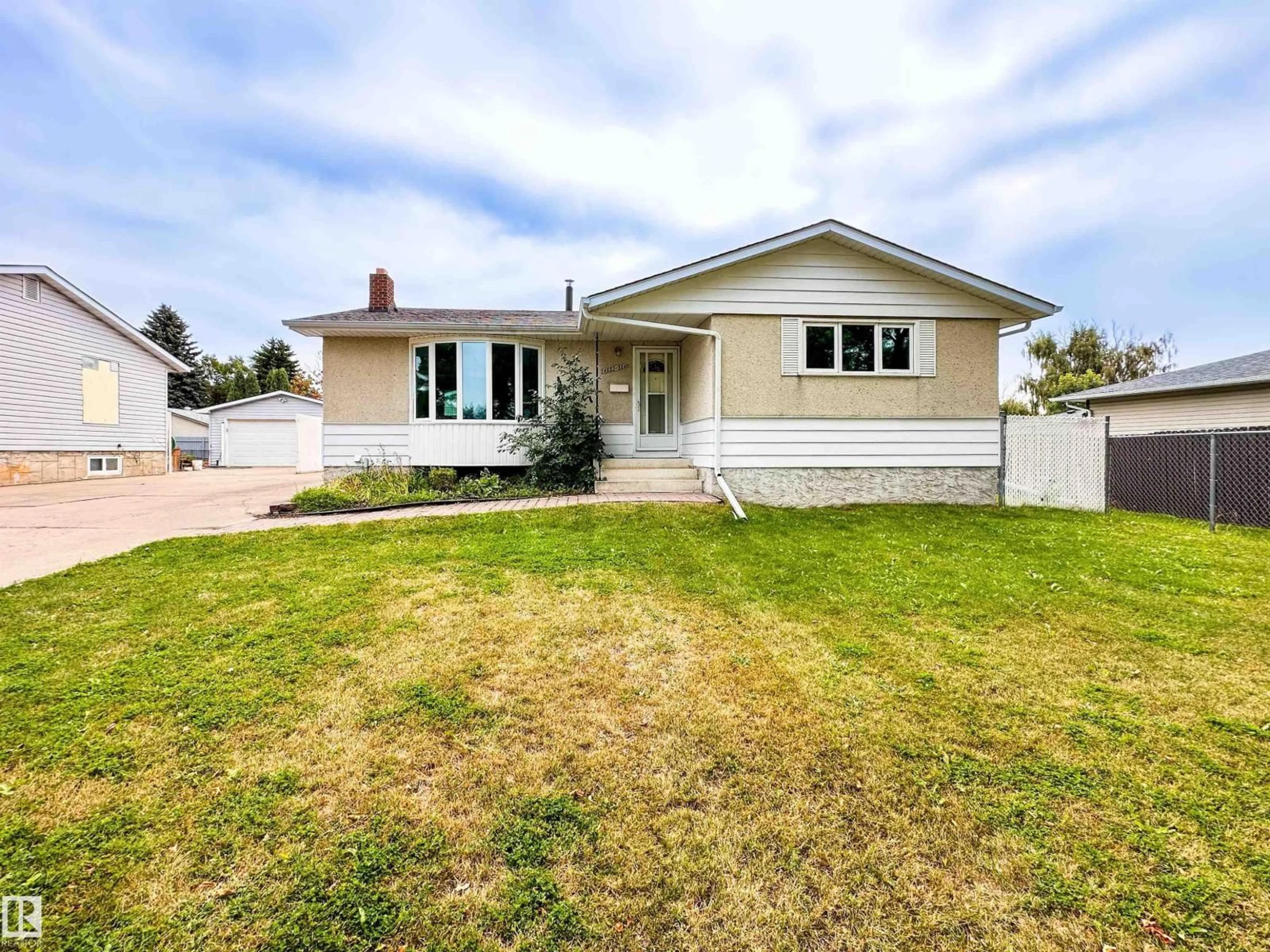 Home with vinyl exterior material, street for 14603 59A ST NW, Edmonton Alberta T5A1Y8
