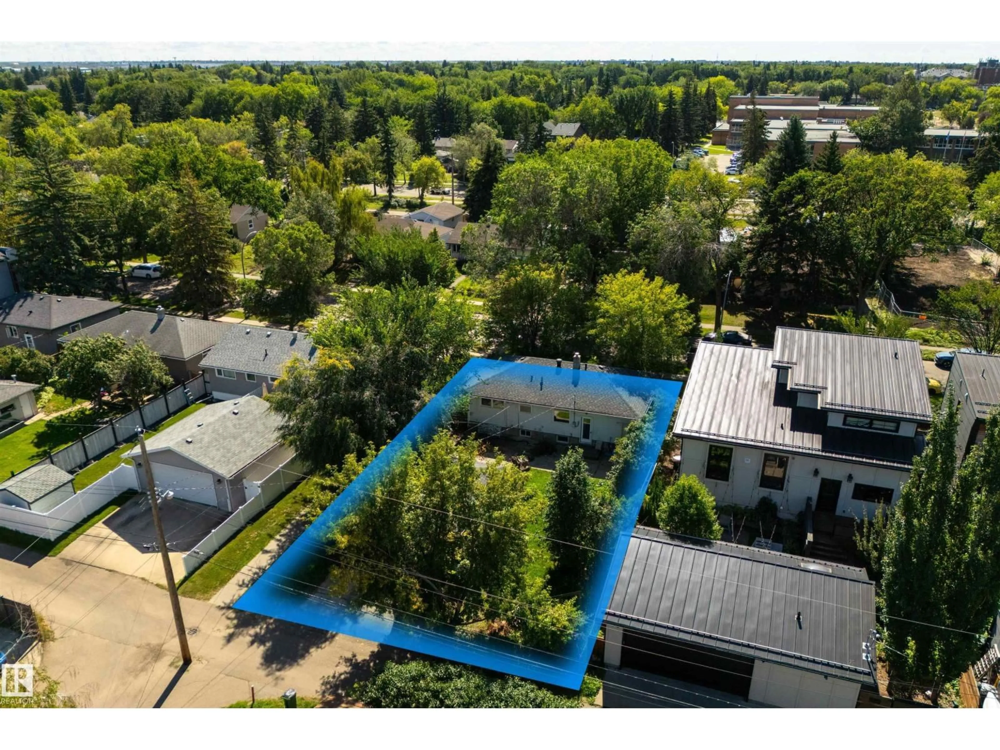 A pic from outside/outdoor area/front of a property/back of a property/a pic from drone, street for 7950 91 AV, Edmonton Alberta T6C1R1