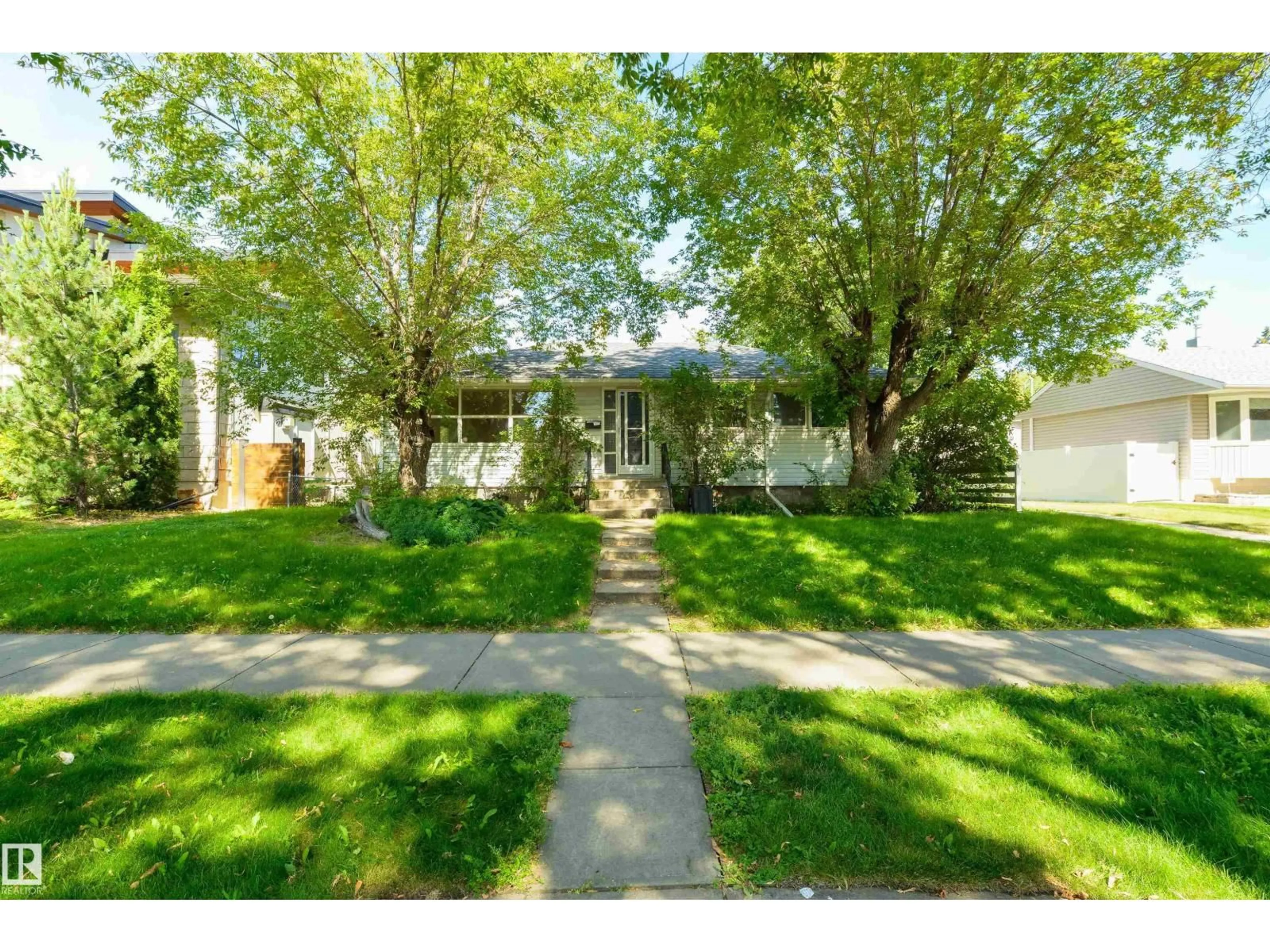 Home with vinyl exterior material, street for 7950 91 AV, Edmonton Alberta T6C1R1