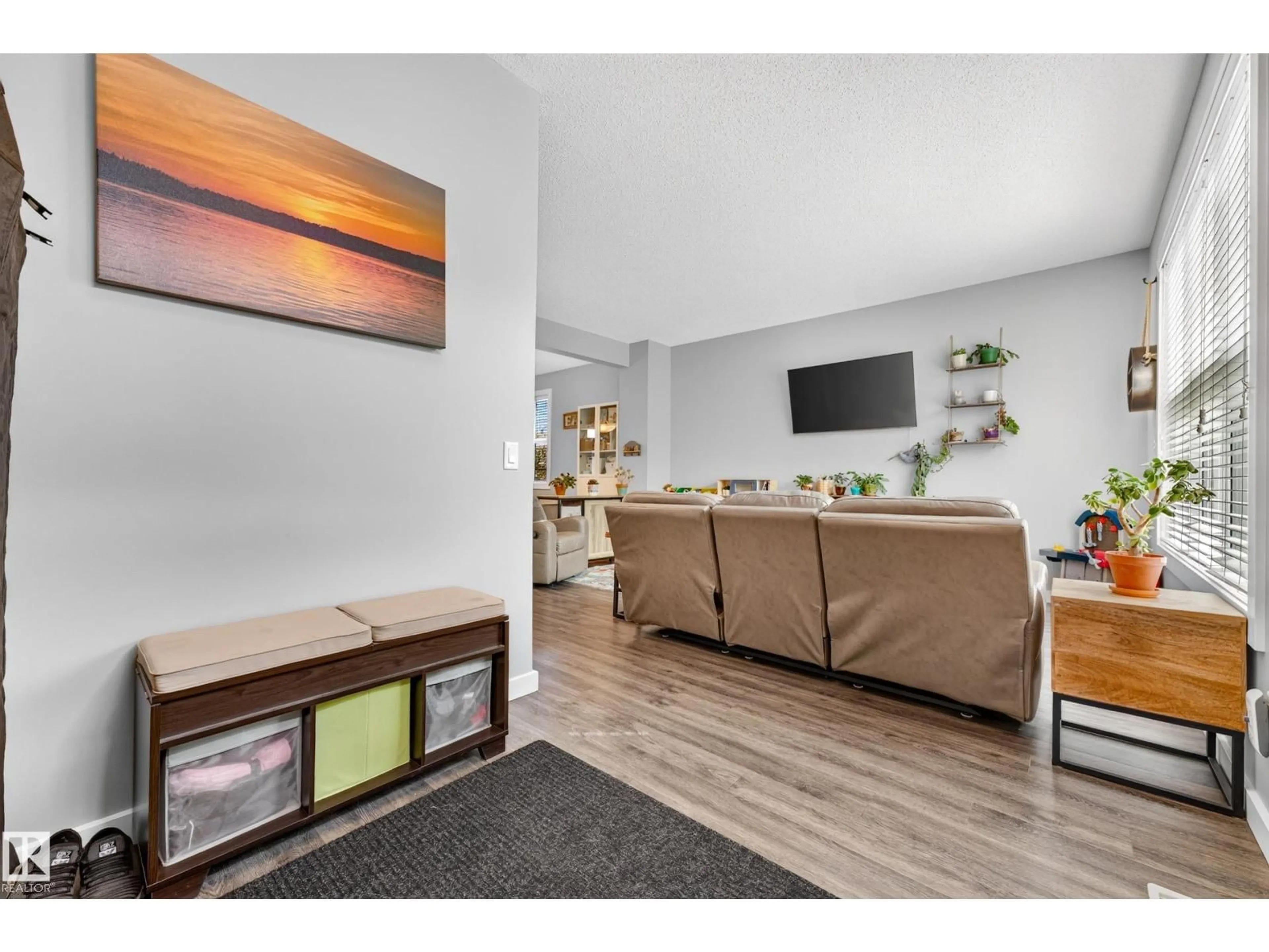 Living room with furniture, wood/laminate floor for 2821 MAPLE WY, Edmonton Alberta T6T0Z7