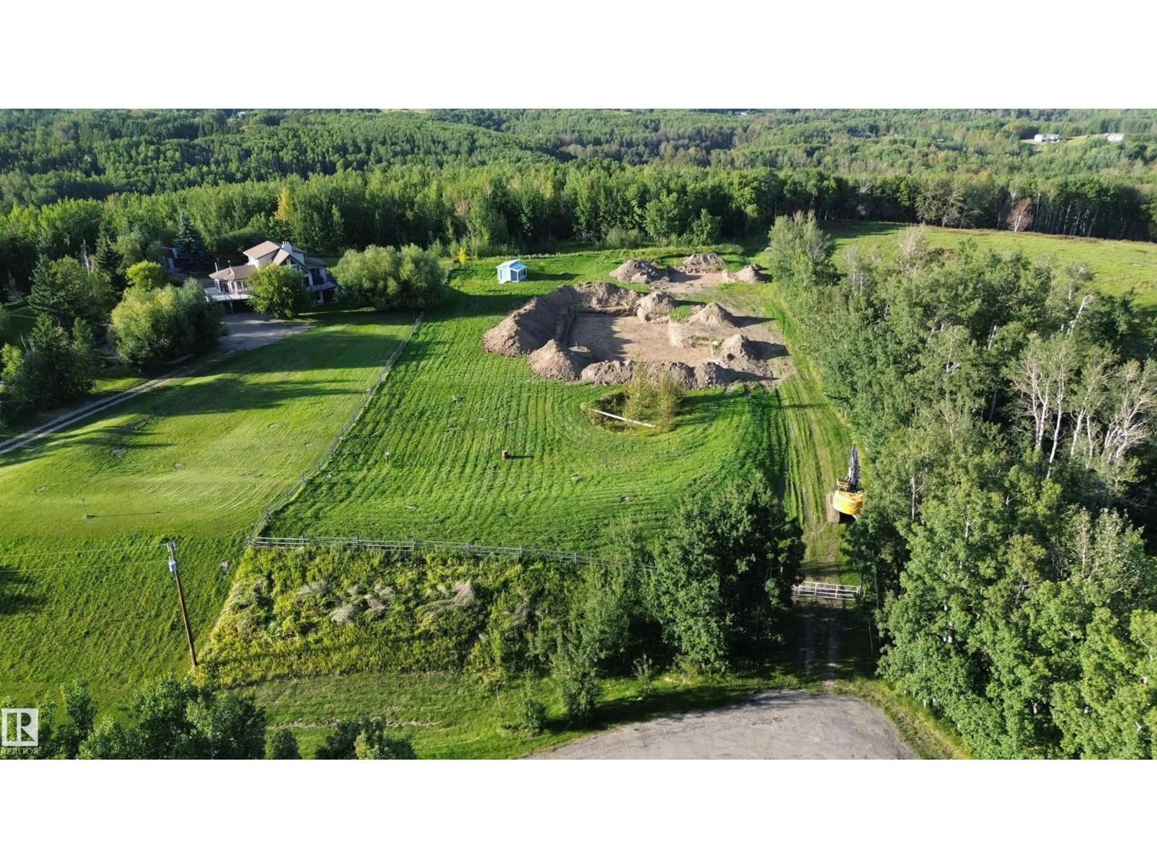 A pic from outside/outdoor area/front of a property/back of a property/a pic from drone, unknown for #9 - 53417 RANGE ROAD 14, Rural Parkland County Alberta T7Y0B5