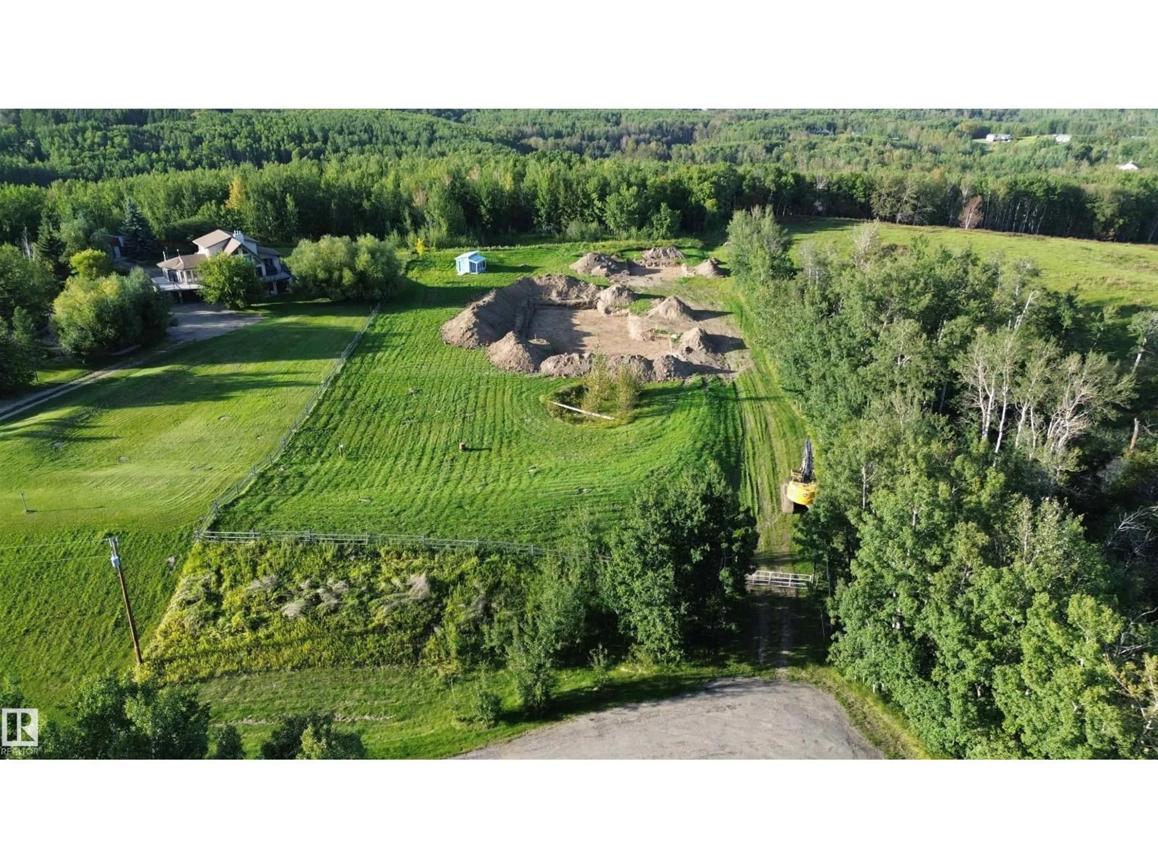 A pic from outside/outdoor area/front of a property/back of a property/a pic from drone, unknown for #9 - 53417 RANGE ROAD 14, Rural Parkland County Alberta T7Y0B5