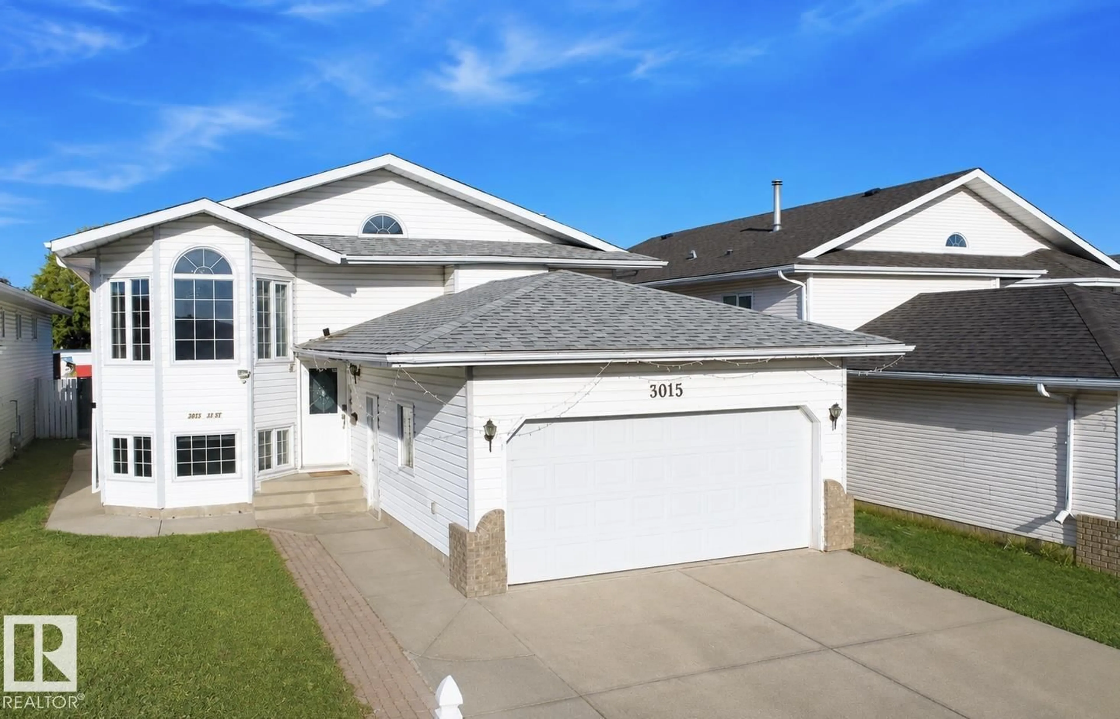 Home with vinyl exterior material, street for 3015 37 ST, Edmonton Alberta T6L5R1