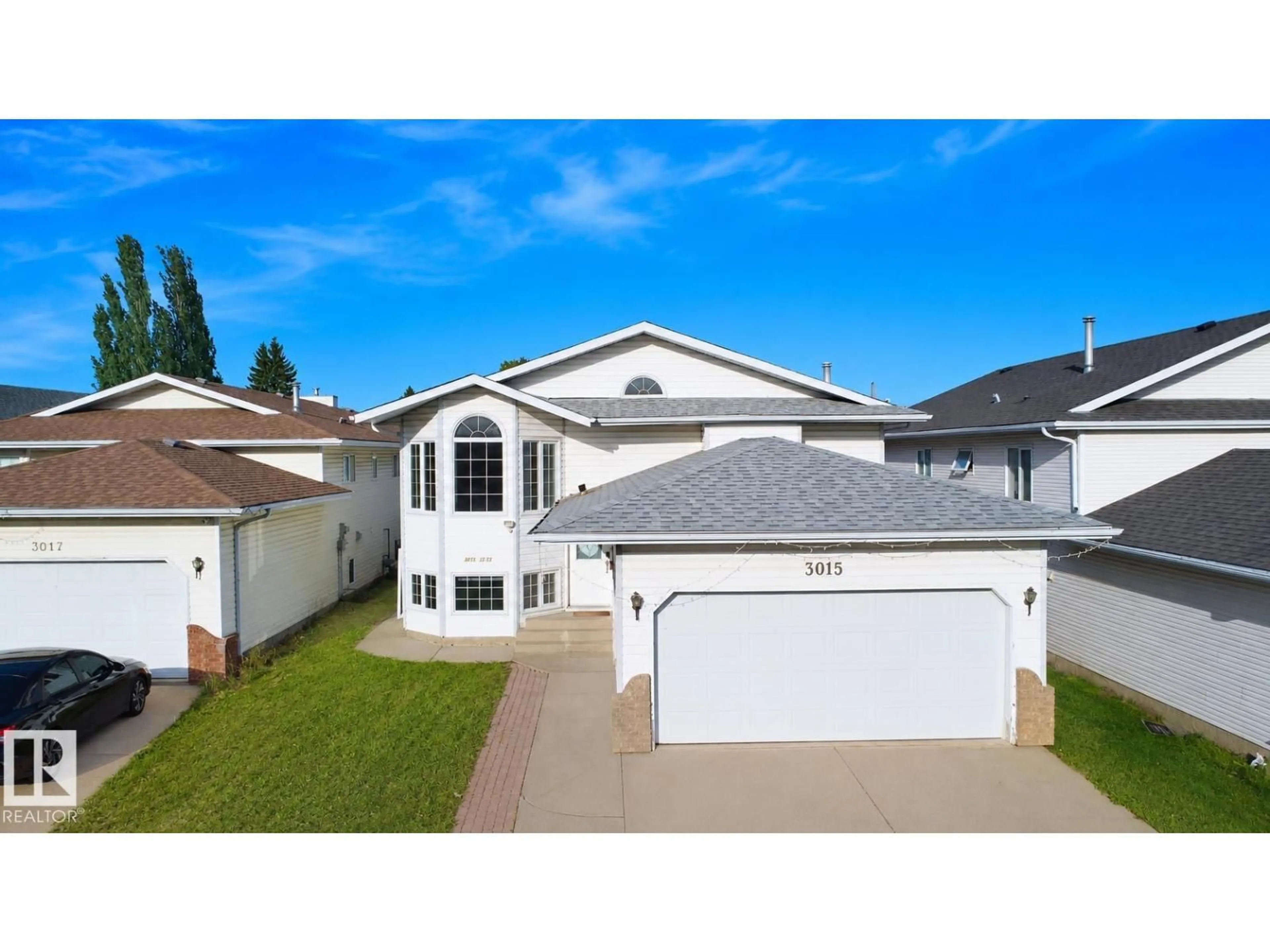 Home with vinyl exterior material, street for 3015 37 ST, Edmonton Alberta T6L5R1