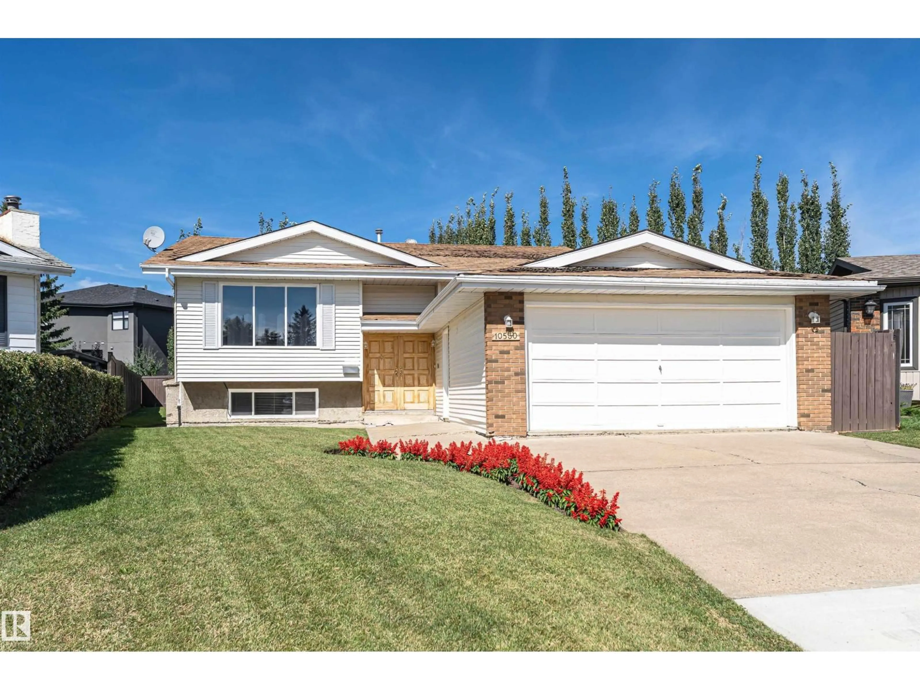 Home with vinyl exterior material, street for 10530 173A AV, Edmonton Alberta T5X3H2