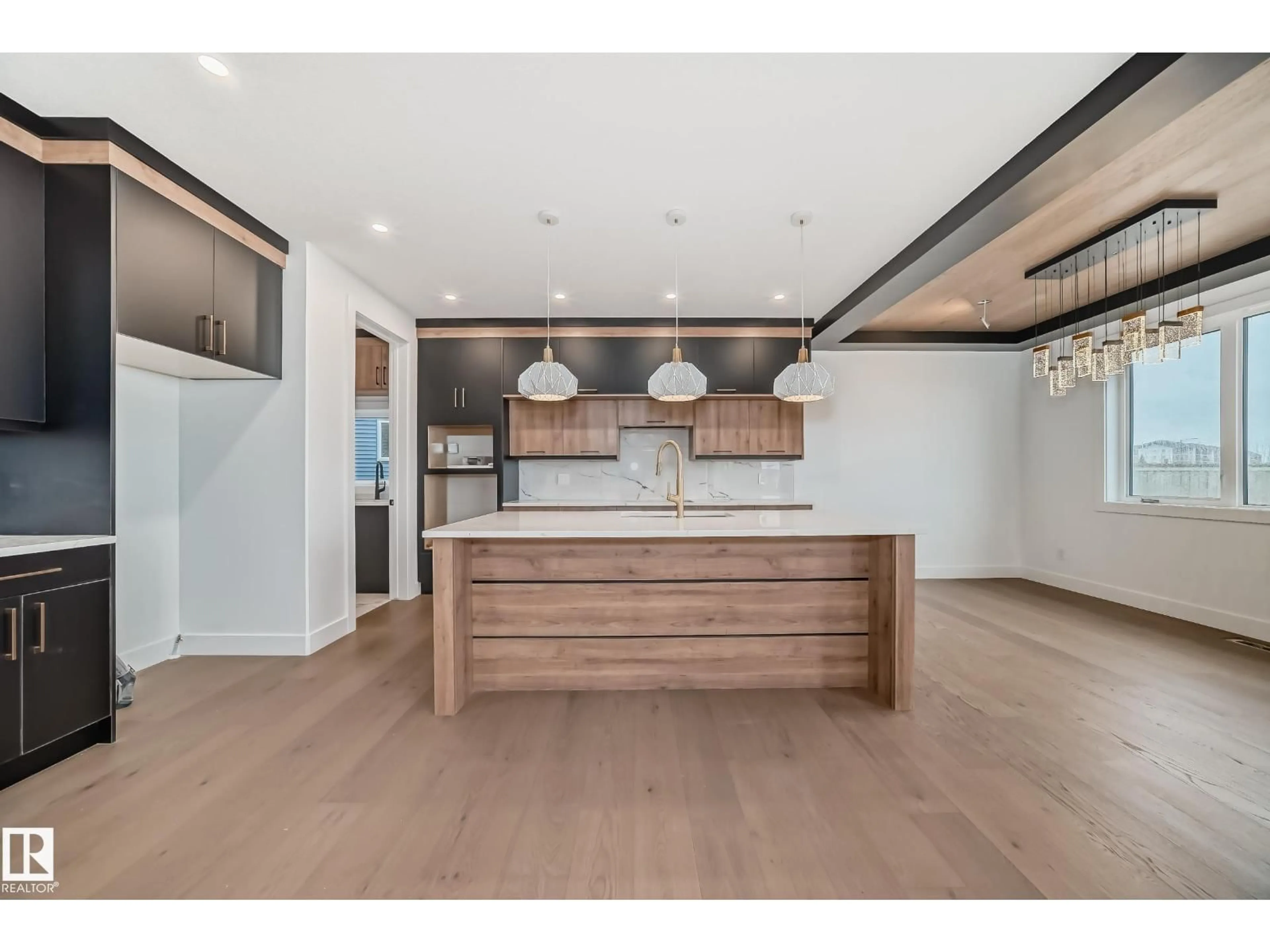 Open concept kitchen, wood/laminate floor for NW - 8418 223 A ST, Edmonton Alberta T5T7X2