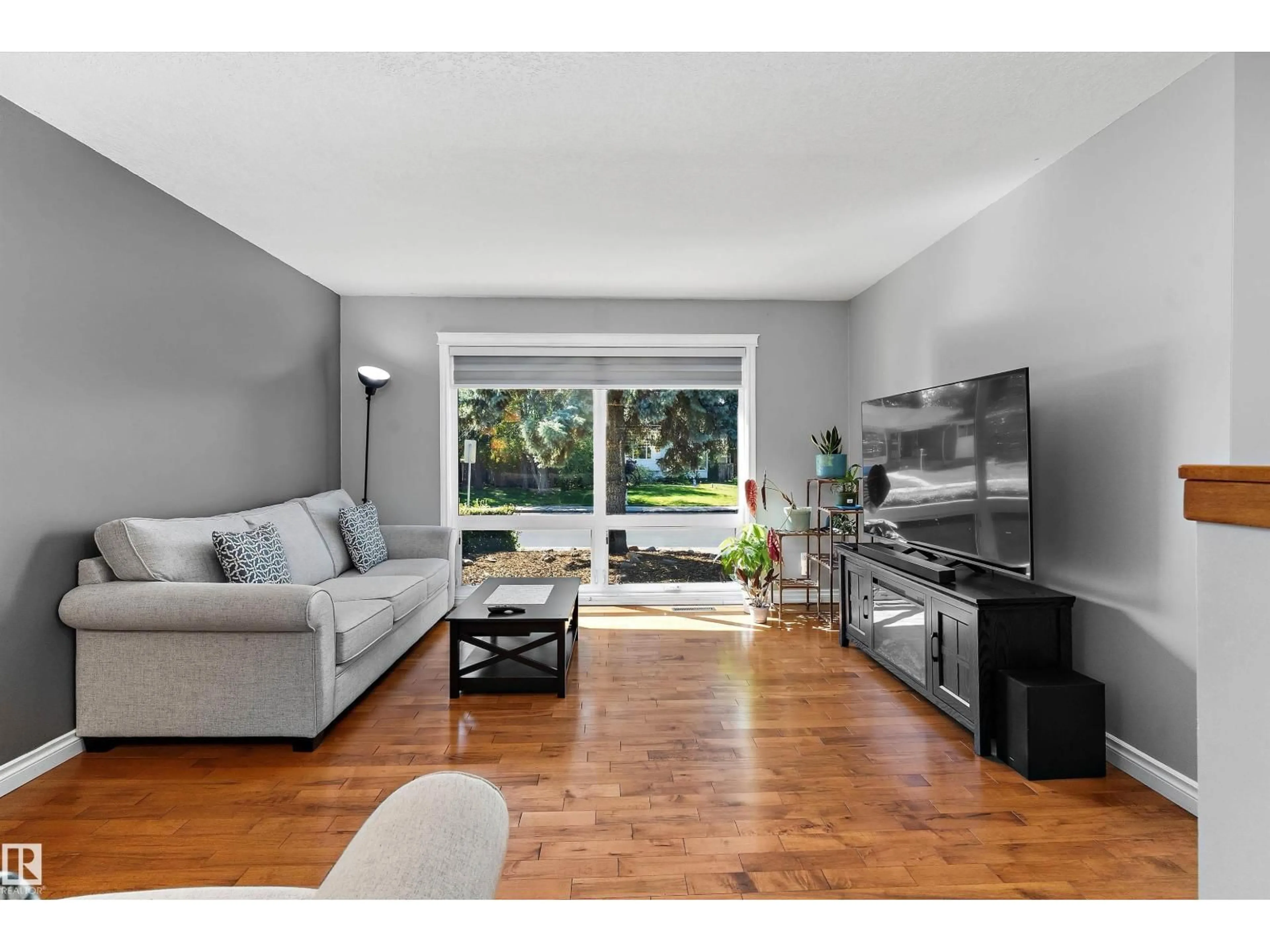 Living room with furniture, wood/laminate floor for 3839 117 ST, Edmonton Alberta T6J1S8